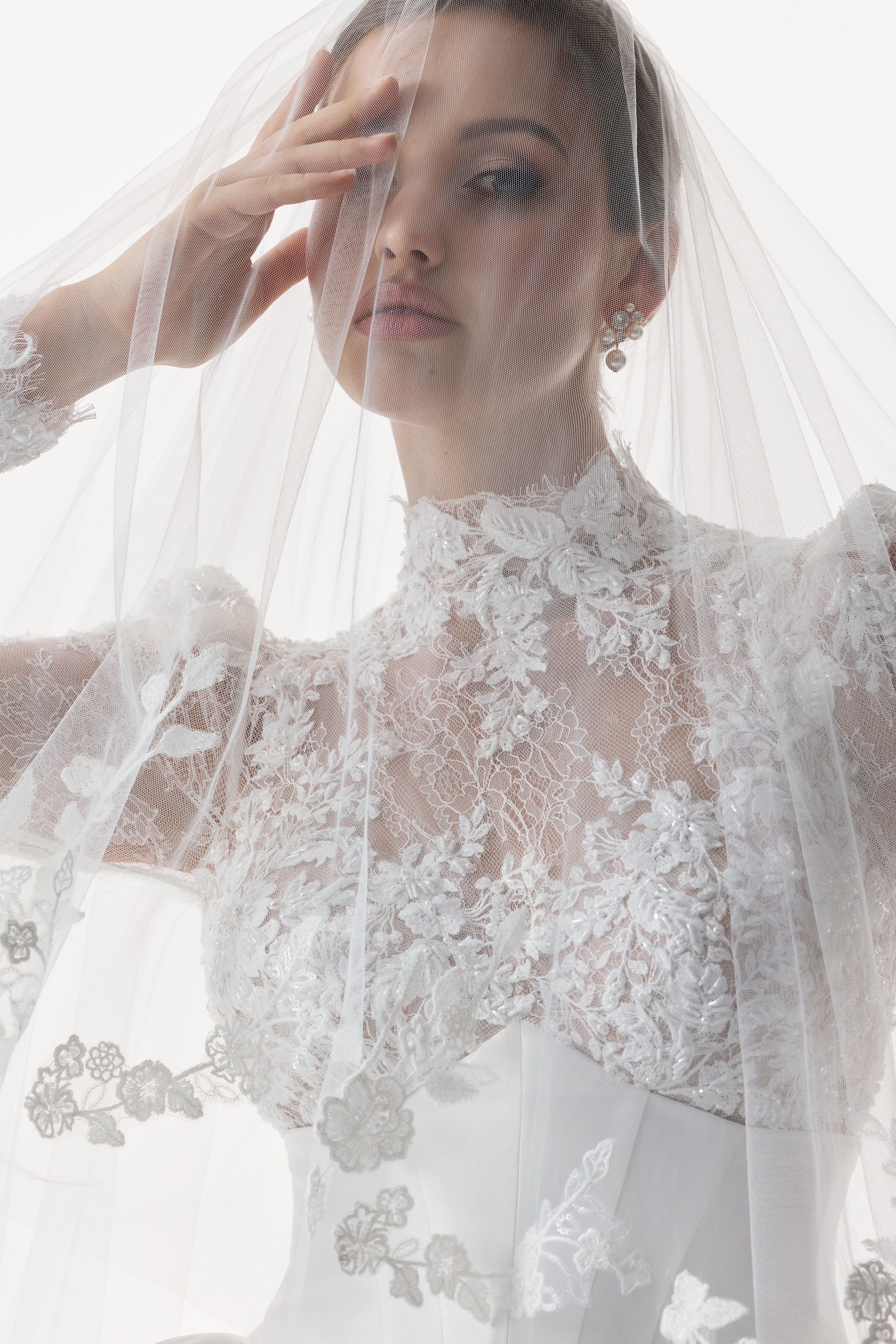 high neck encrusted lace bodice with corset and basque waist with full silk mikado A-line ballgown skirt and veil