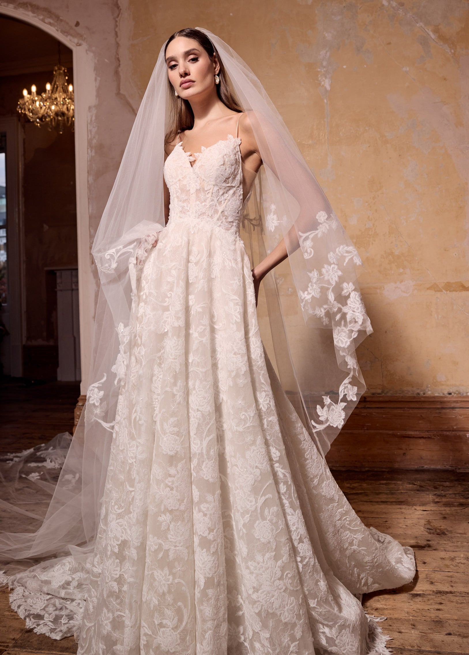 sweetheart neckline strap lace corset A-line dress with pearl buttons and matching lace wedding veil