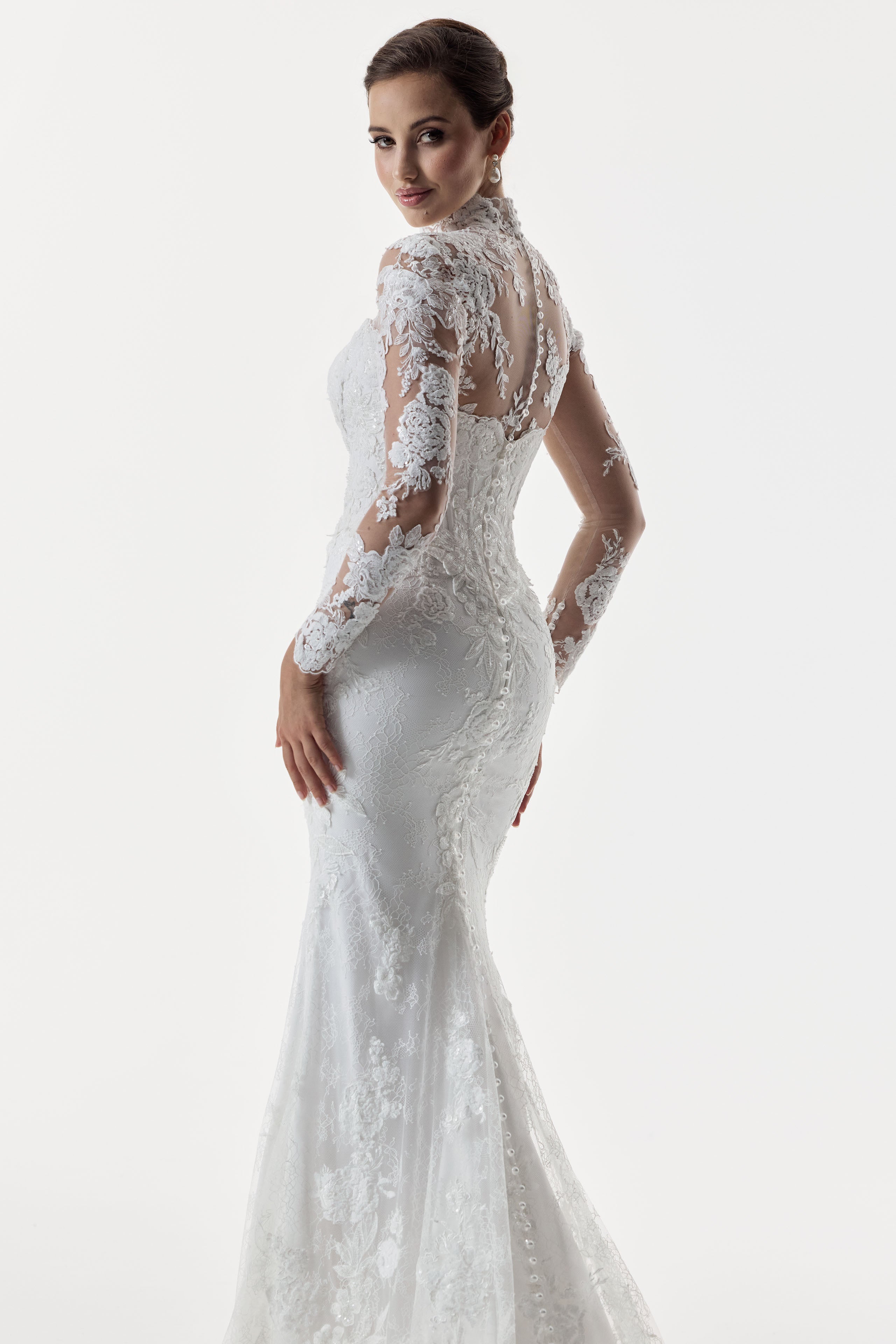 strapless scoop neckline embellished lace applique layered over Chantilly lace corset bodice basque waist with a detachable fitted skirt with high neck long sleeve lace topper with pearl buttons