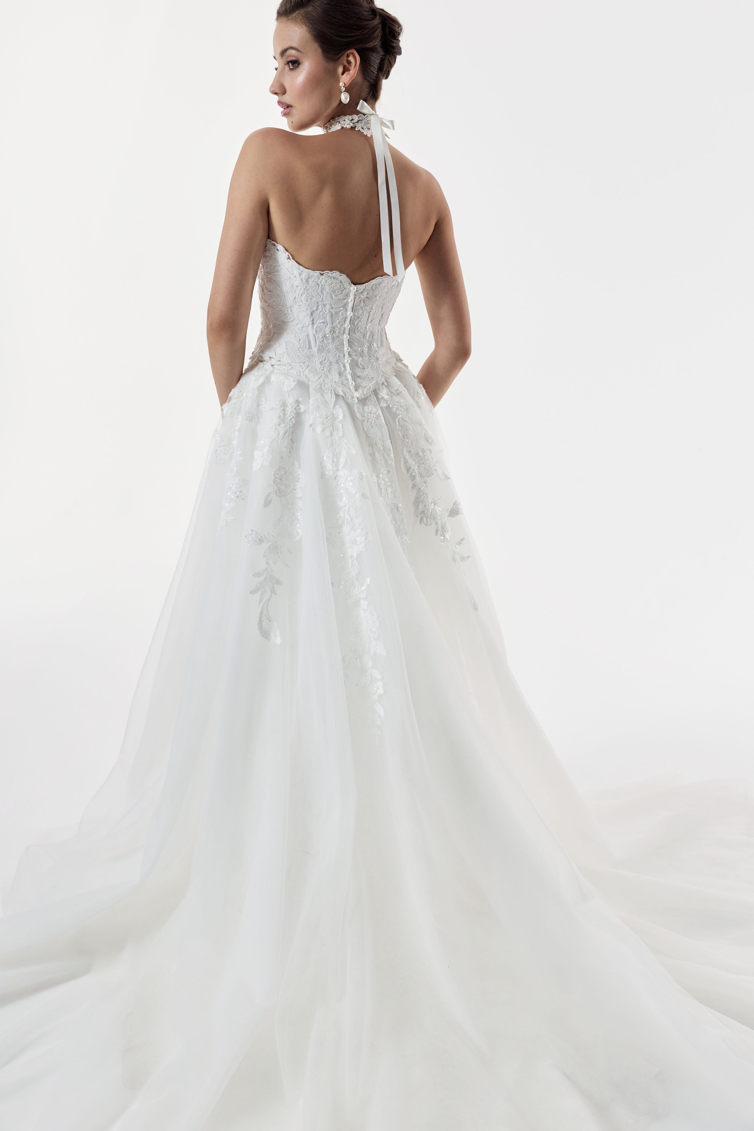 strapless scoop neckline embellished lace applique layered over Chantilly lace corset bodice basque waist with a detachable fitted skirt and choker and pearl buttons on the back