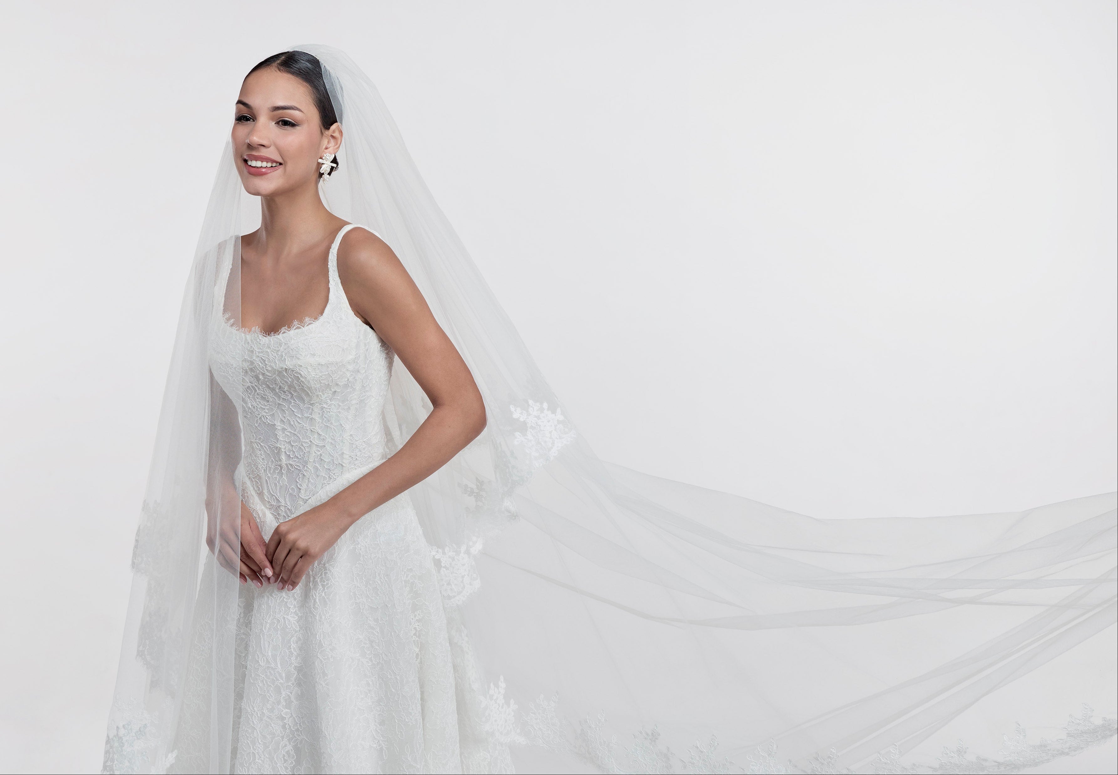 lace square neckline with basque waist and corset and A-line skirt with lace veil