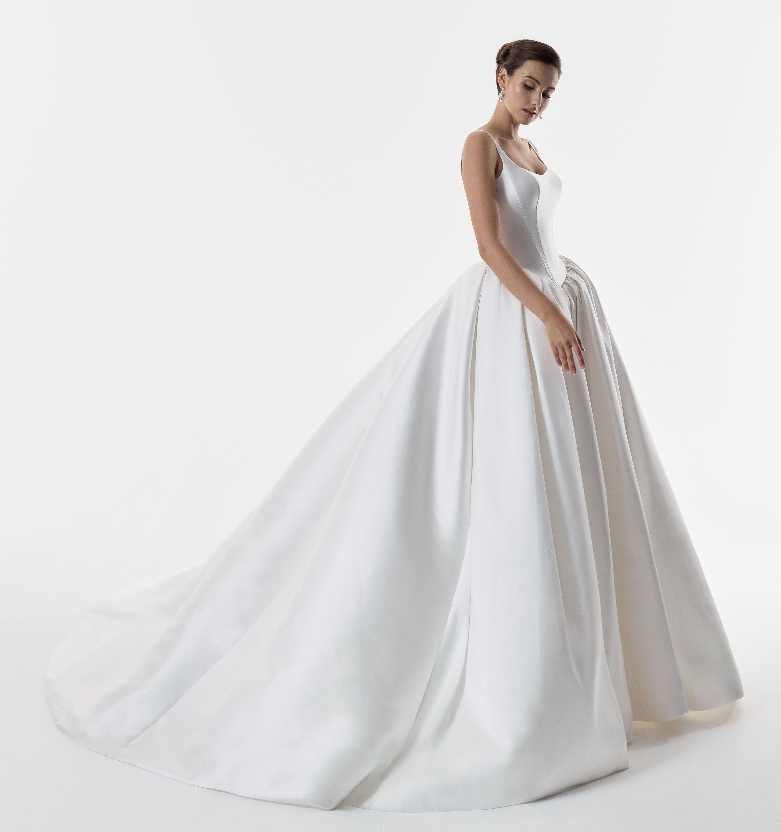 square and scoop strap neckline with a flattering basque waist corset and ballgown A-line skirt
