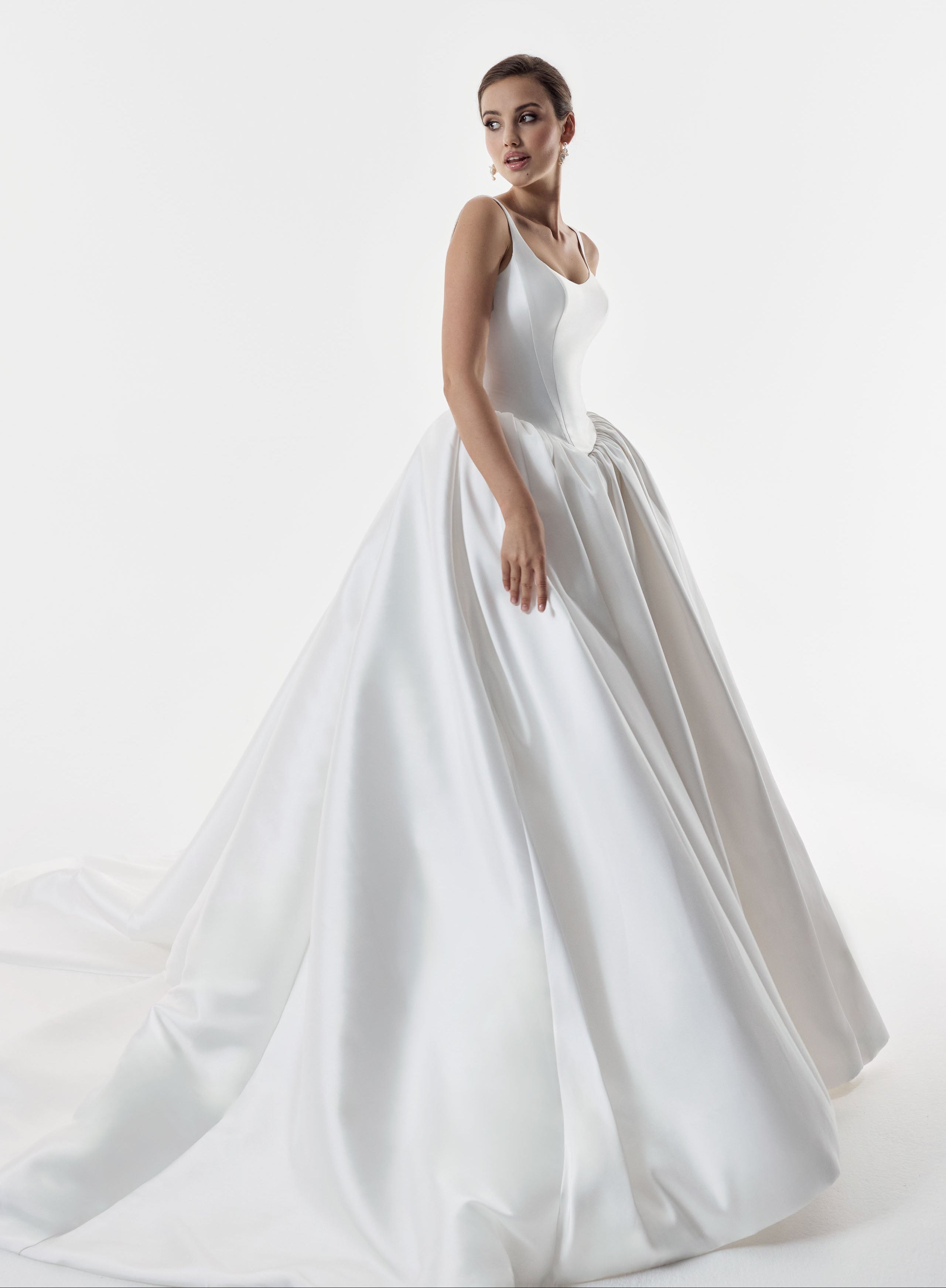 square and scoop strap neckline with a flattering basque waist corset and ballgown A-line skirt