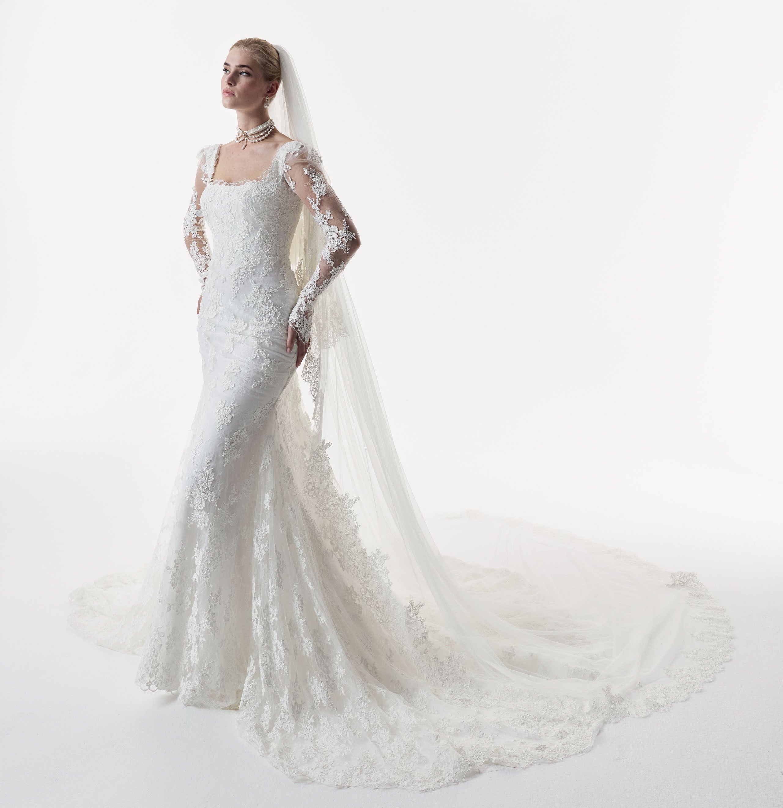 square neckline fitted sheath dress with corded lace layered over delicate Chantilly lace and matching sleeves and choker and wedding veil