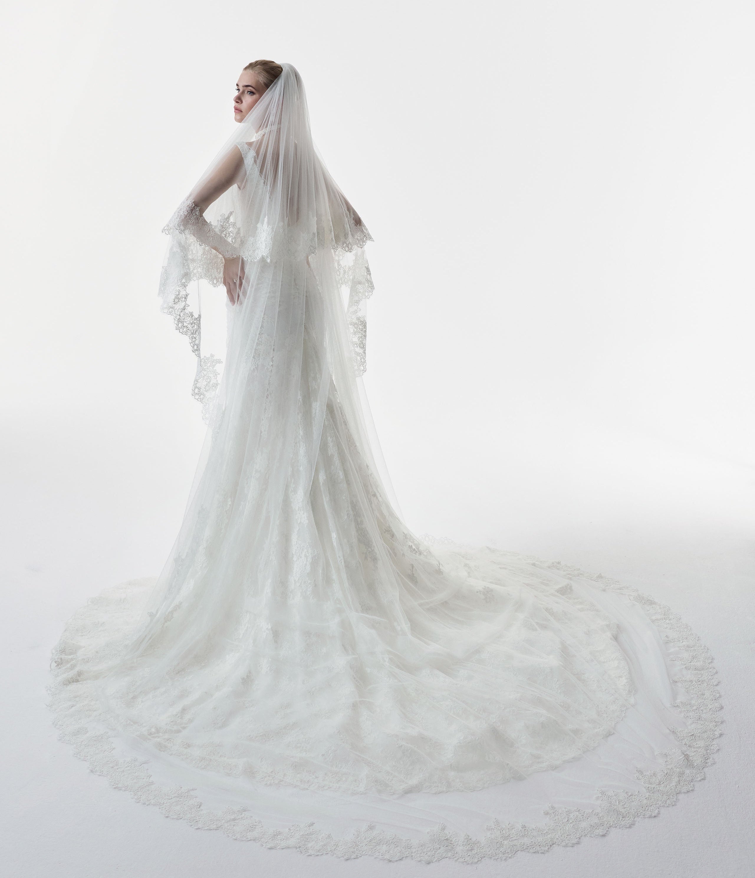 square neckline fitted sheath dress with corded lace layered over delicate Chantilly lace with matching double tier wedding veil