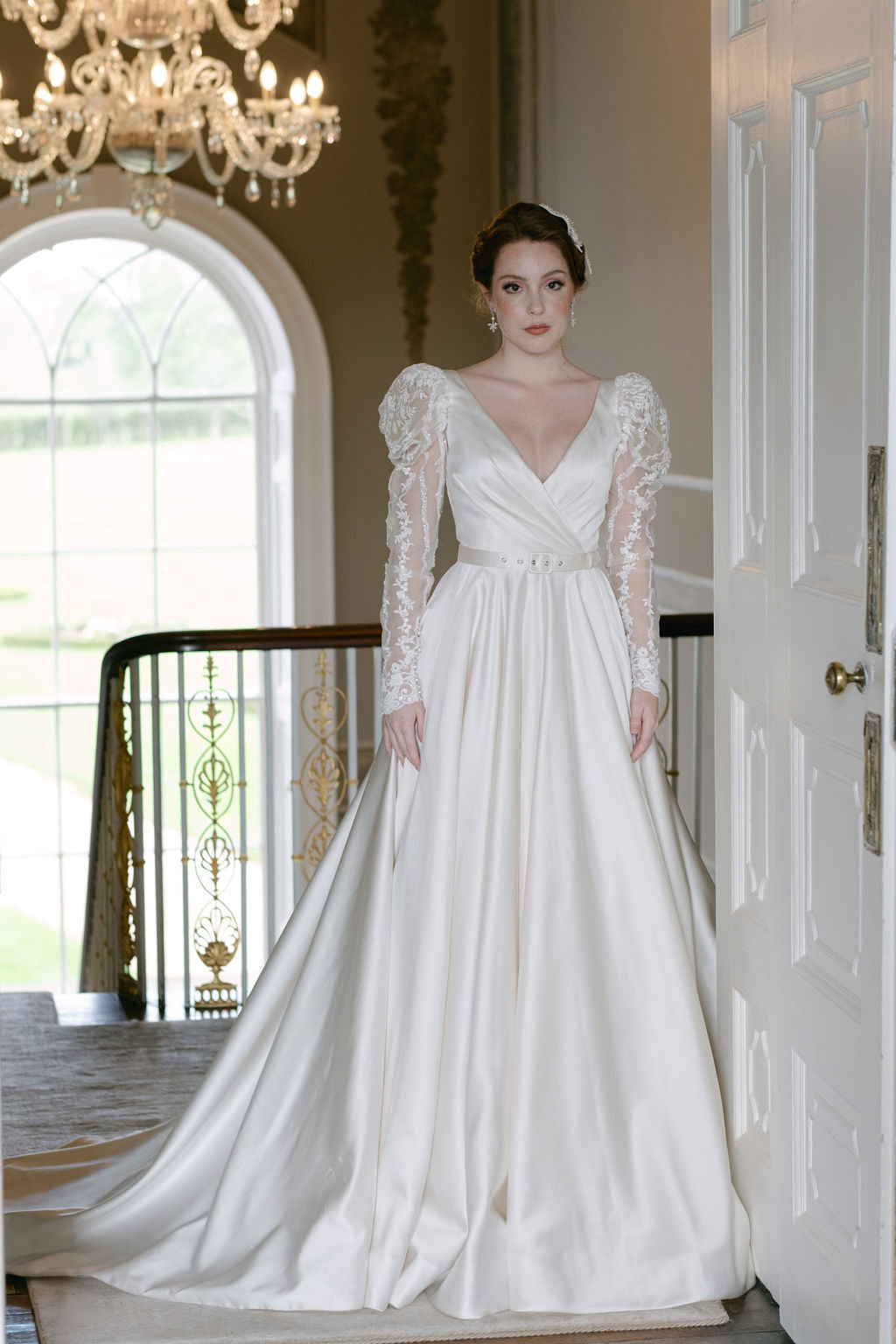 Full skirted a-line gown with flattering neckline, detachable belt and bow. Sumptuous satin with inner corset, full circle skirt with concealed pockets.