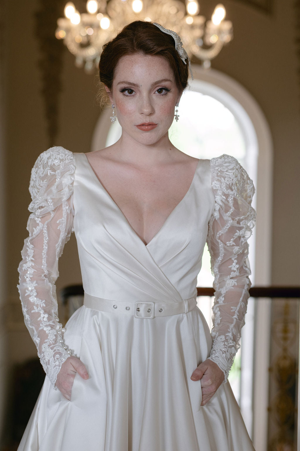Full skirted a-line gown with flattering neckline, detachable belt and bow. Sumptuous satin with inner corset, full circle skirt with concealed pockets.