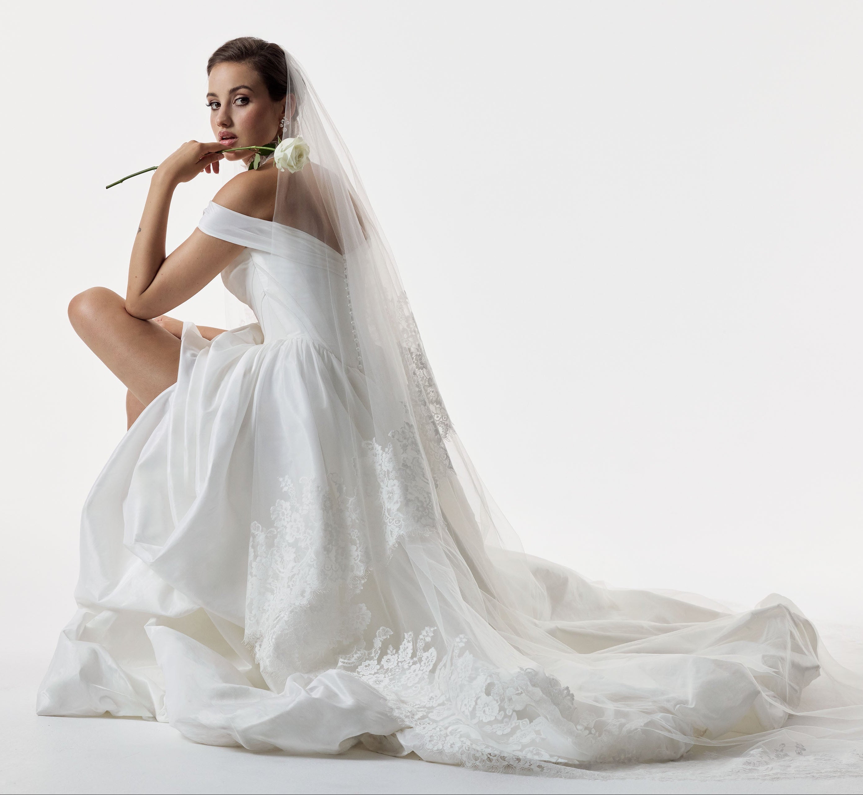 classic ivory bardot neckline and corset basque waist and ruched pick-up skirt leg slit detailing