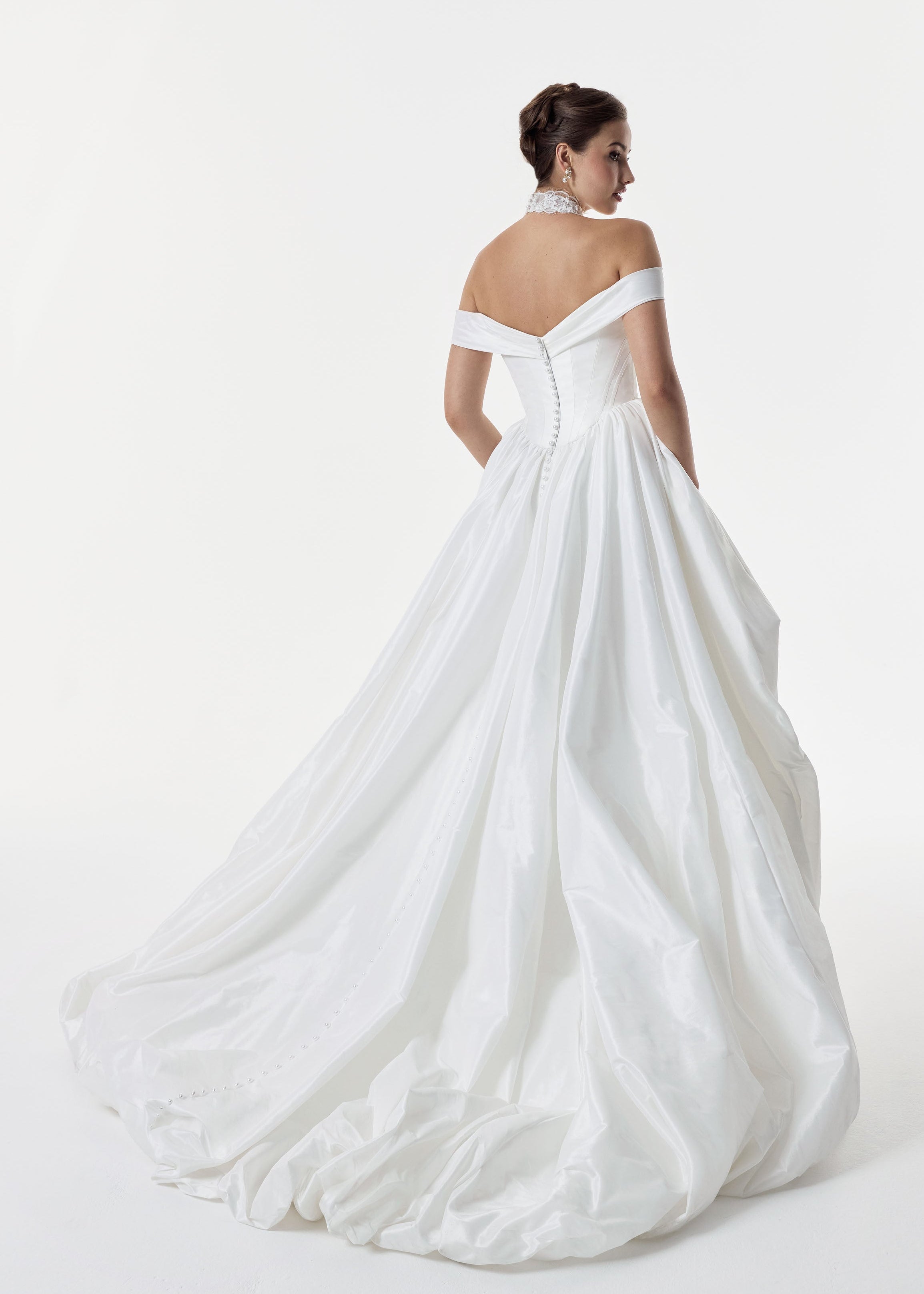 classic ivory bardot neckline and corset basque waist and ruched pick-up skirt leg slit detailing
