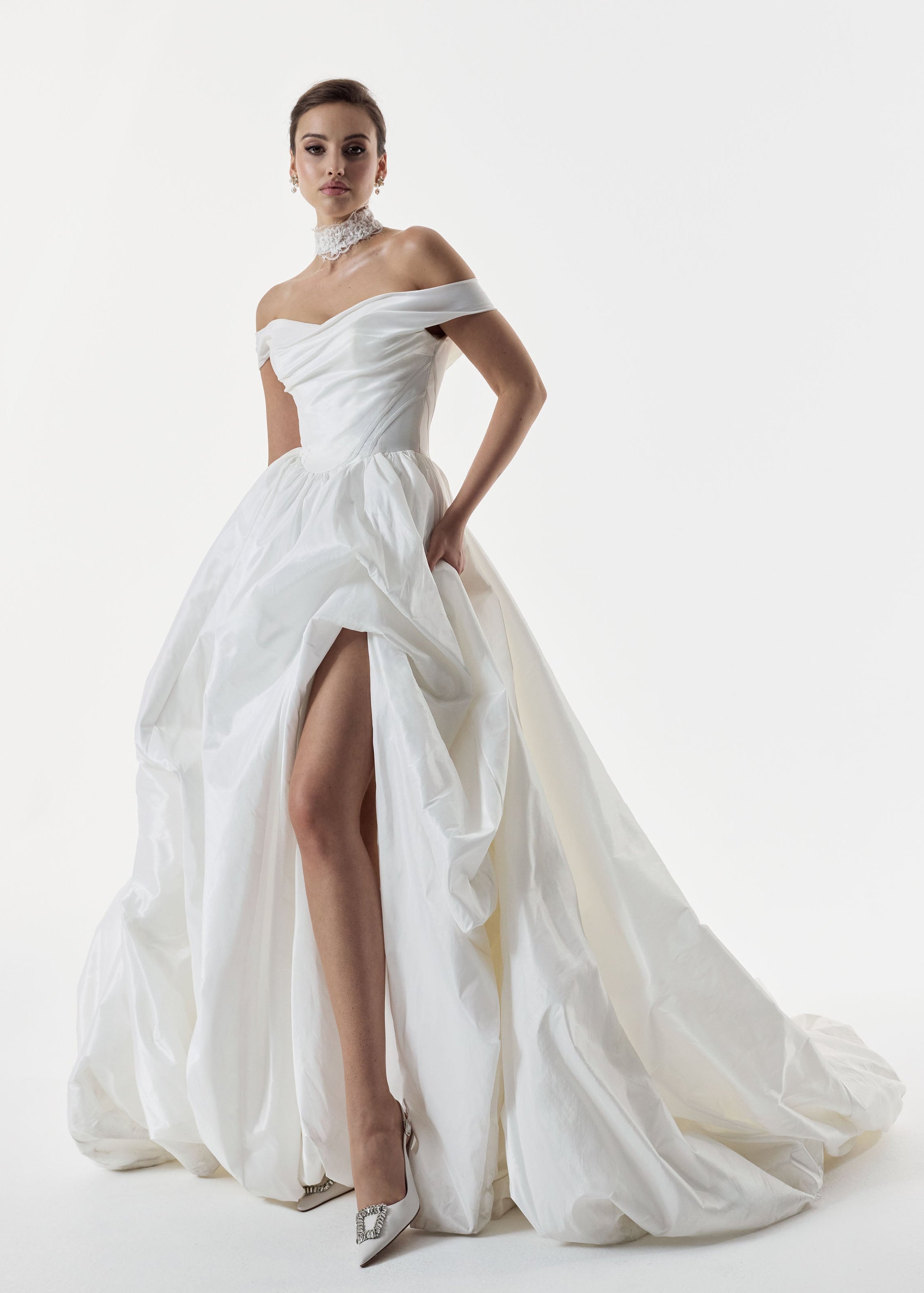 classic ivory bardot neckline and corset basque waist and ruched pick-up skirt leg slit detailing