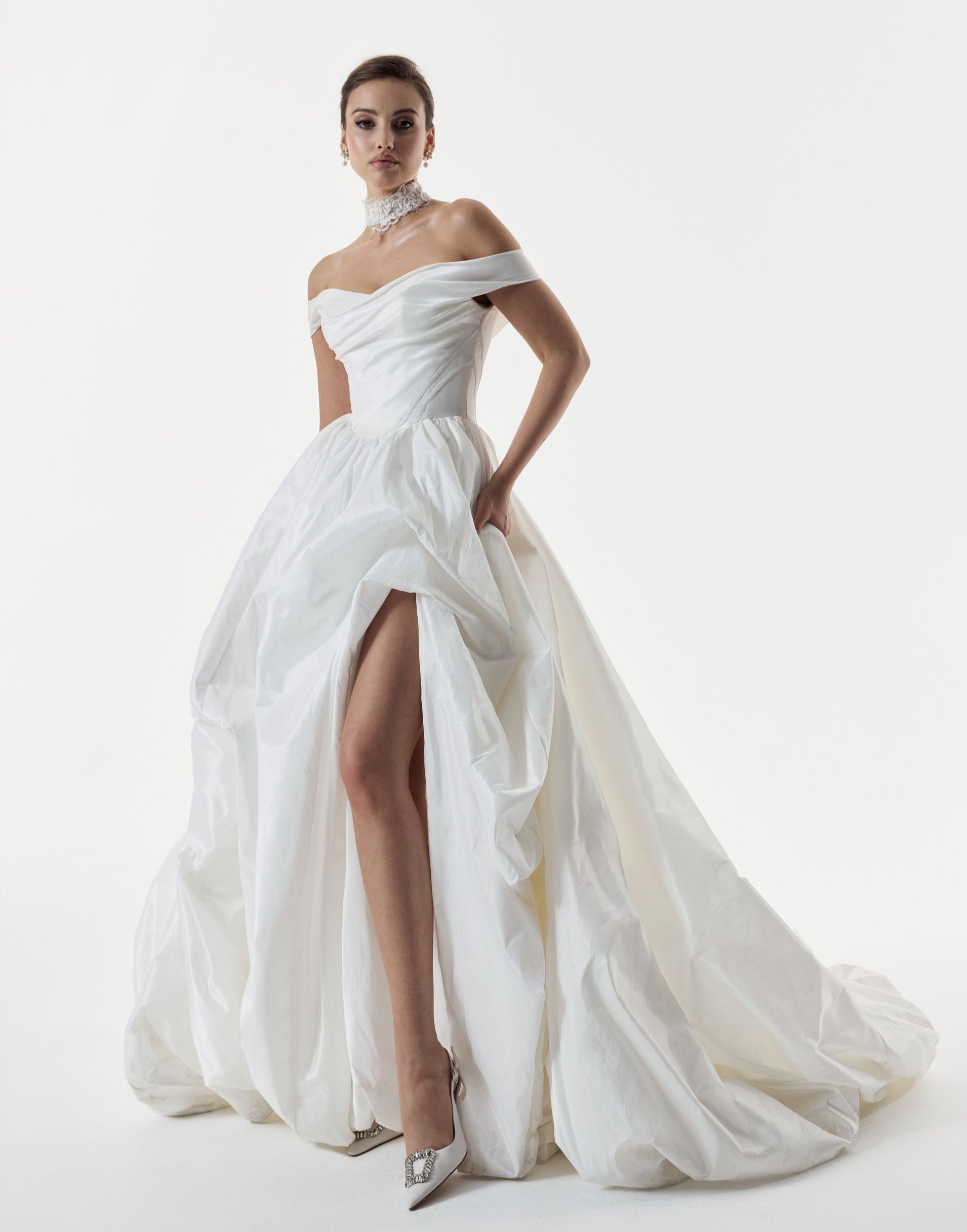 classic ivory bardot neckline and corset basque waist and ruched pick-up skirt leg slit detailing