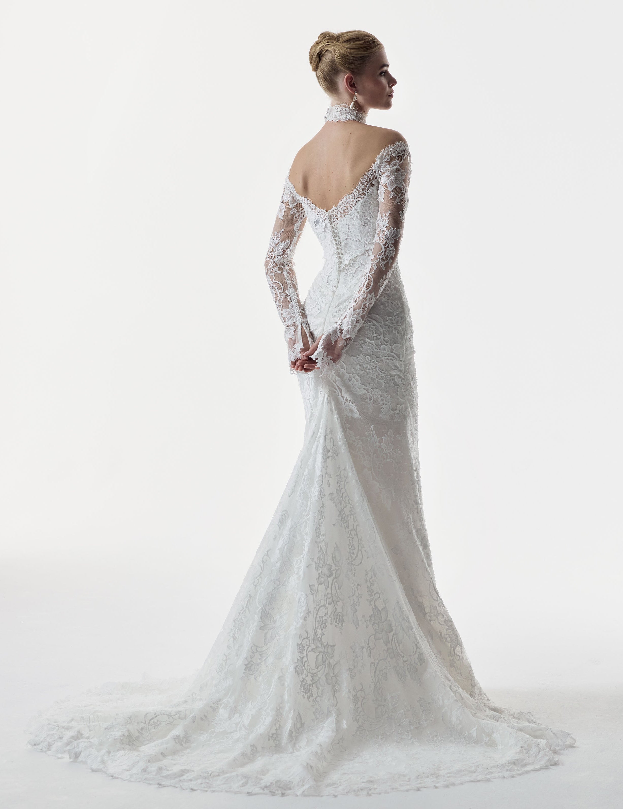 sweetheart neckline and fitted strapless Chantilly lace bodice with basque waist with matching lace sleeves and choker