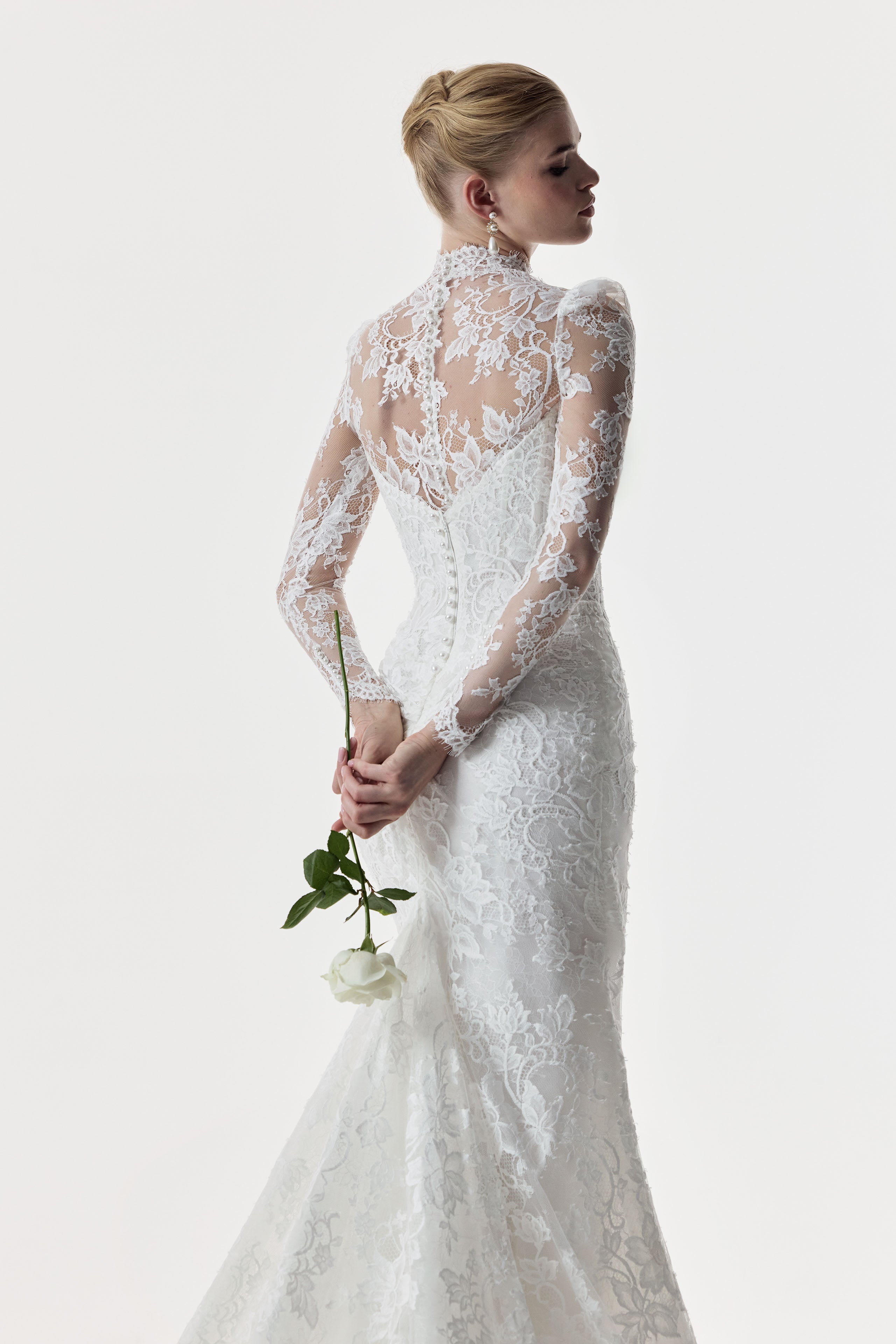 sweetheart neckline and fitted strapless Chantilly lace bodice with basque waist with high neck lace topper