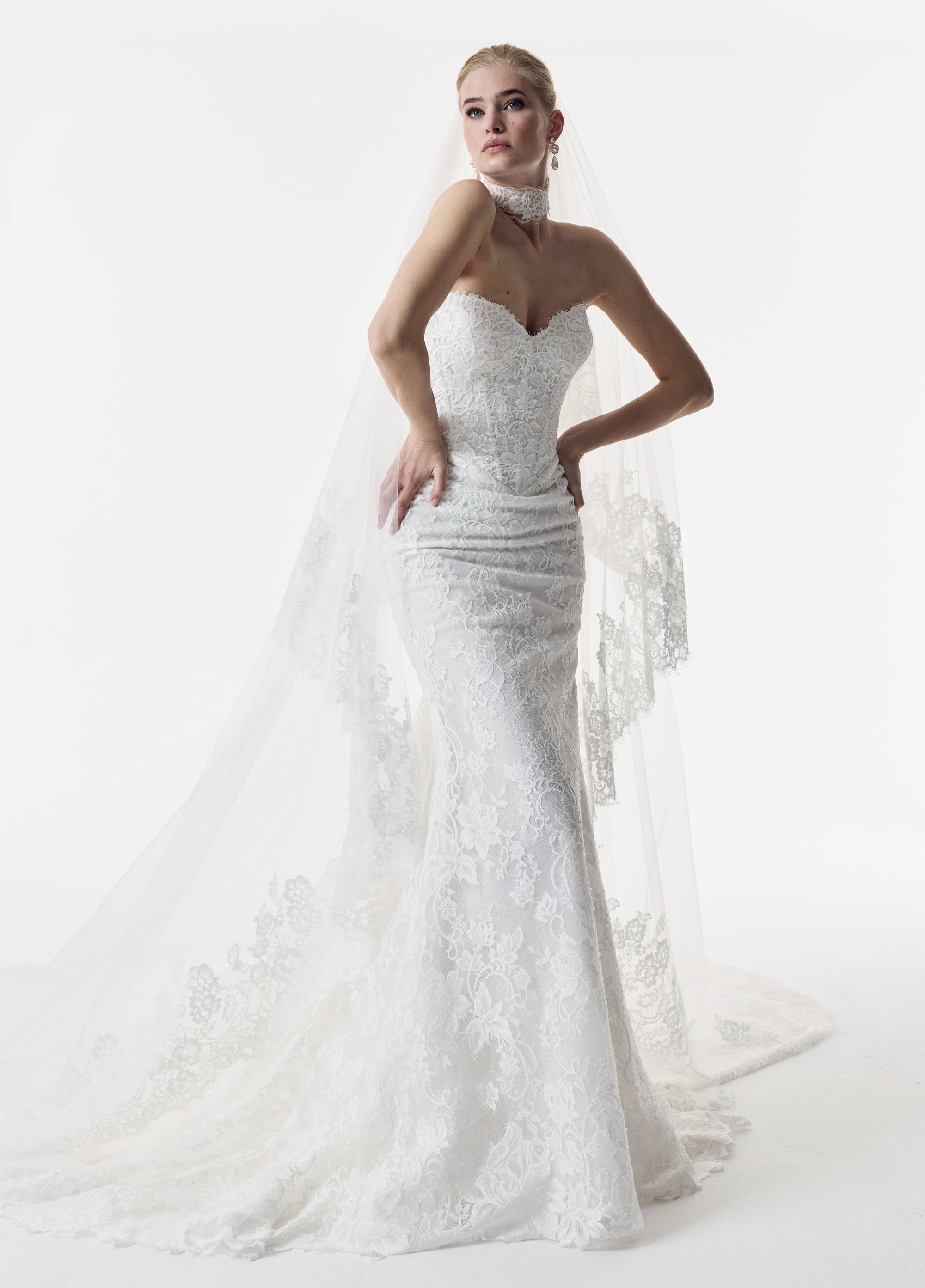 sweetheart neckline and fitted strapless Chantilly lace bodice with basque waist with lace choker and veil