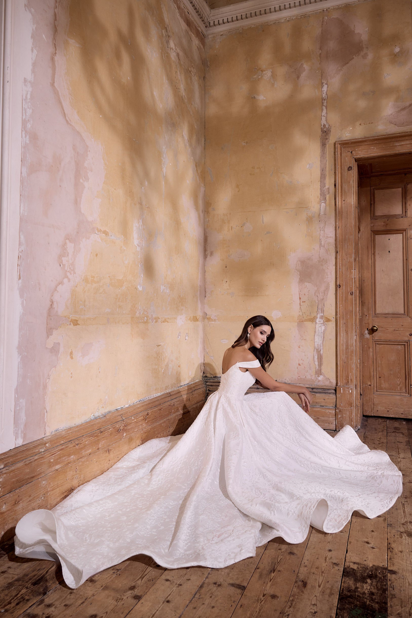 off the shoulder lux embossed silk jacquard with a draped bodice inner corset and full A-line skirt with pearl buttons and detachable straps