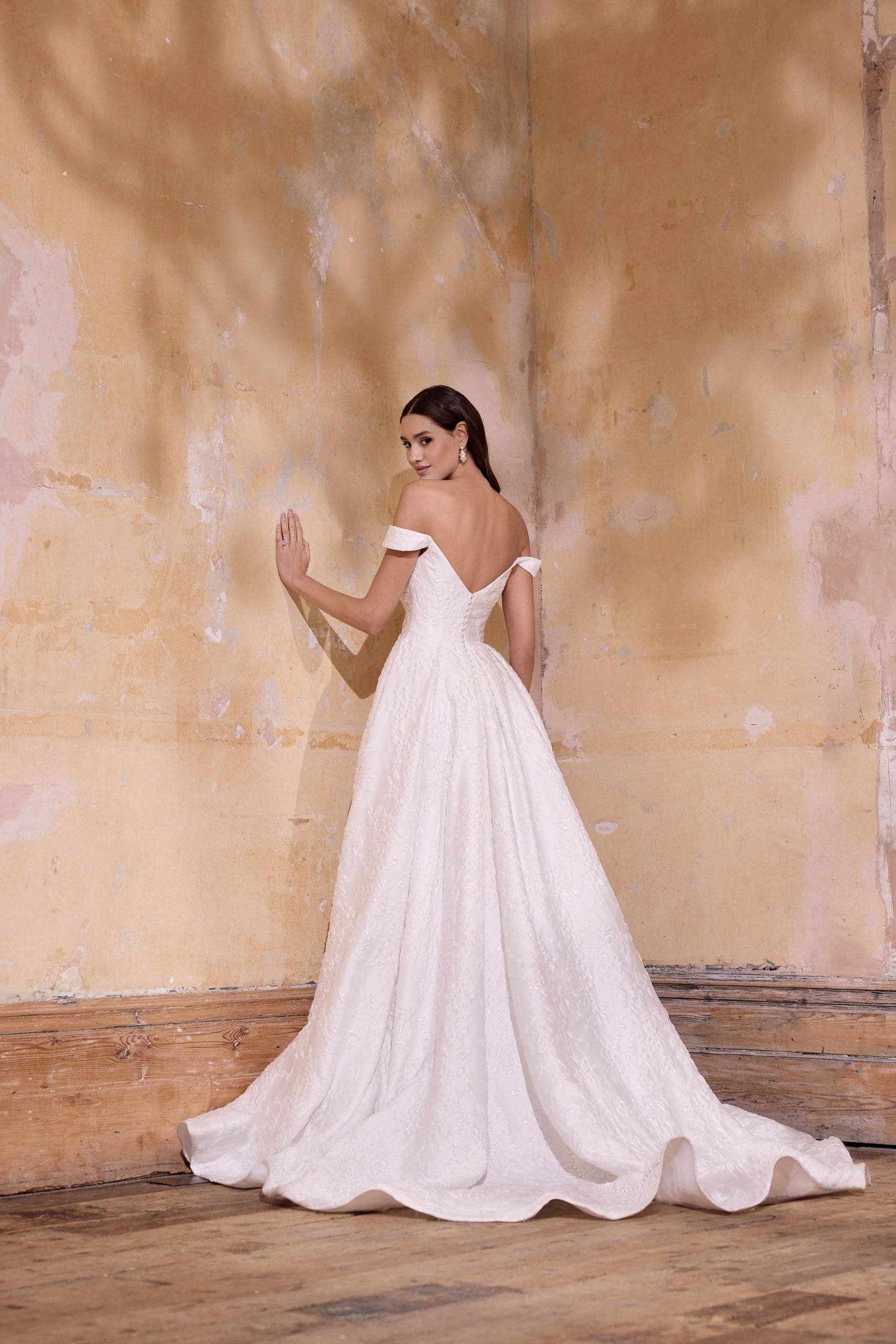off the shoulder lux embossed silk jacquard with a draped bodice inner corset and full A-line skirt with pearl buttons and detachable straps