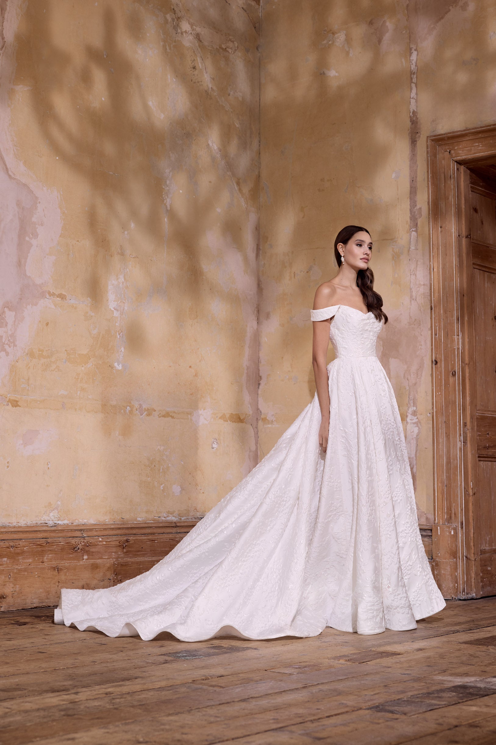 off the shoulder lux embossed silk jacquard with a draped bodice inner corset and full A-line skirt with pearl buttons and detachable straps