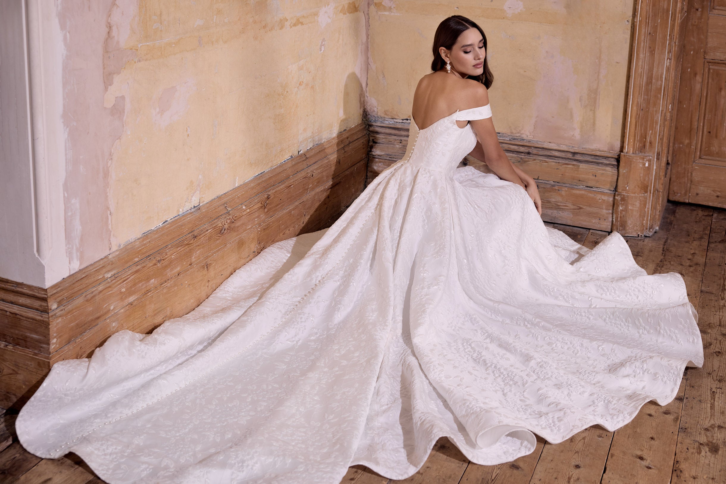 off the shoulder lux embossed silk jacquard with a draped bodice inner corset and full A-line skirt with pearl buttons and detachable straps