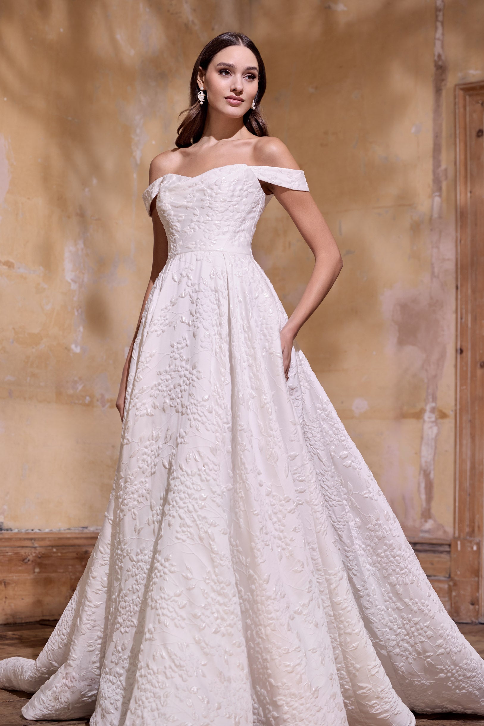 off the shoulder lux embossed silk jacquard with a draped bodice inner corset and full A-line skirt with pearl buttons and detachable straps