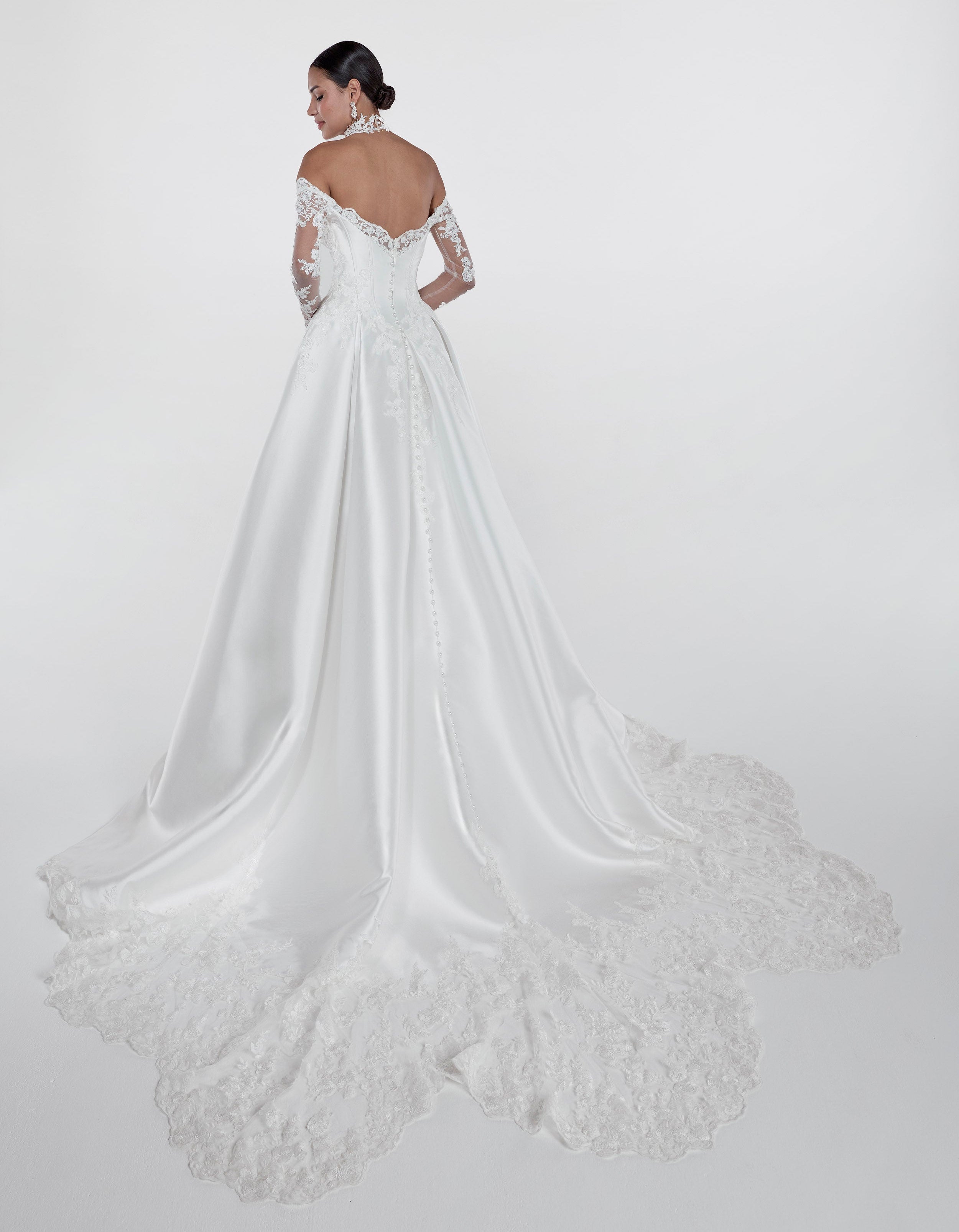 ruched lace applique sweetheart neckline with a draped bust and silk Mikado corset and A-line skirt and lace sleeves