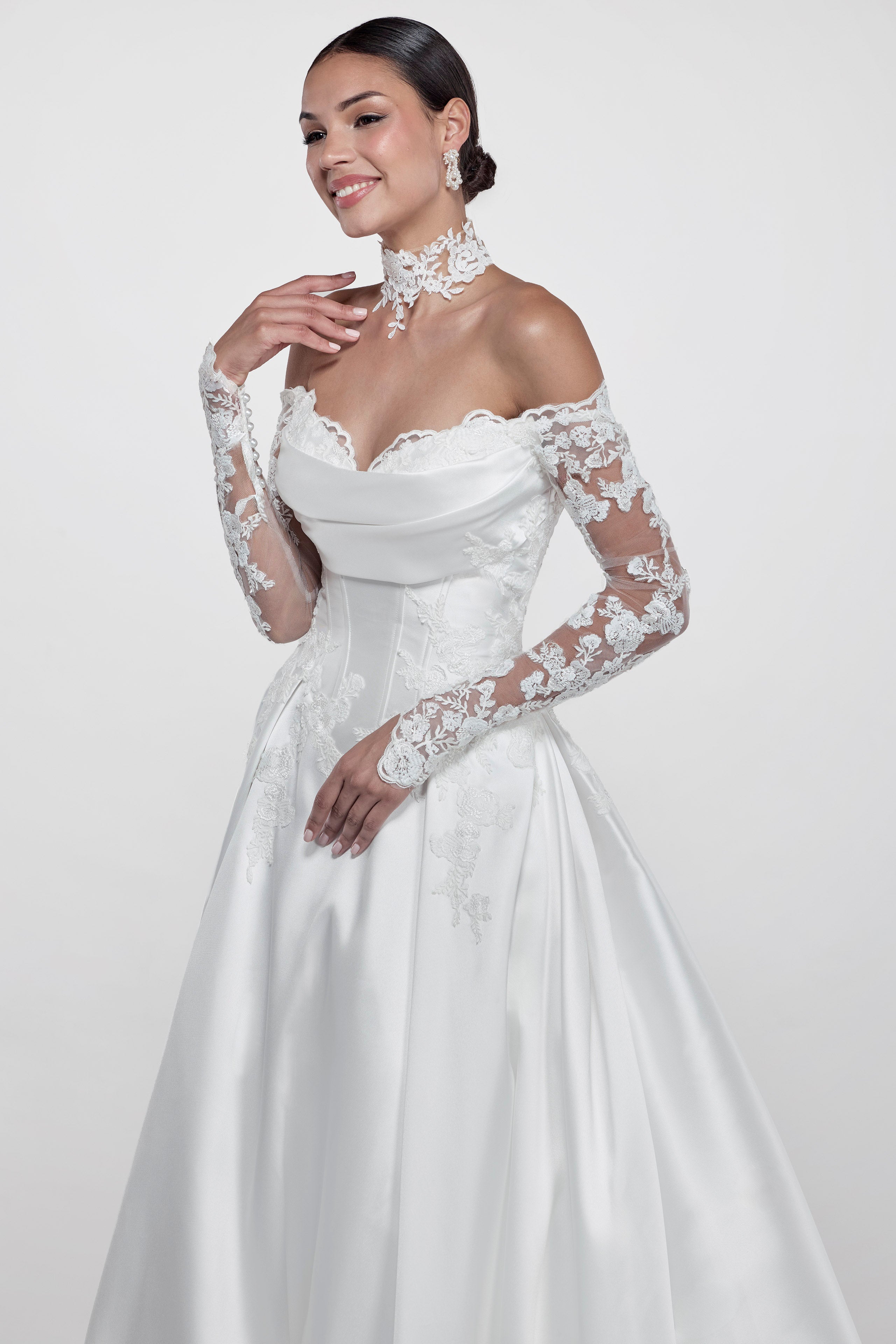 ruched lace applique sweetheart neckline with a draped bust and silk Mikado corset and A-line skirt and lace sleeves