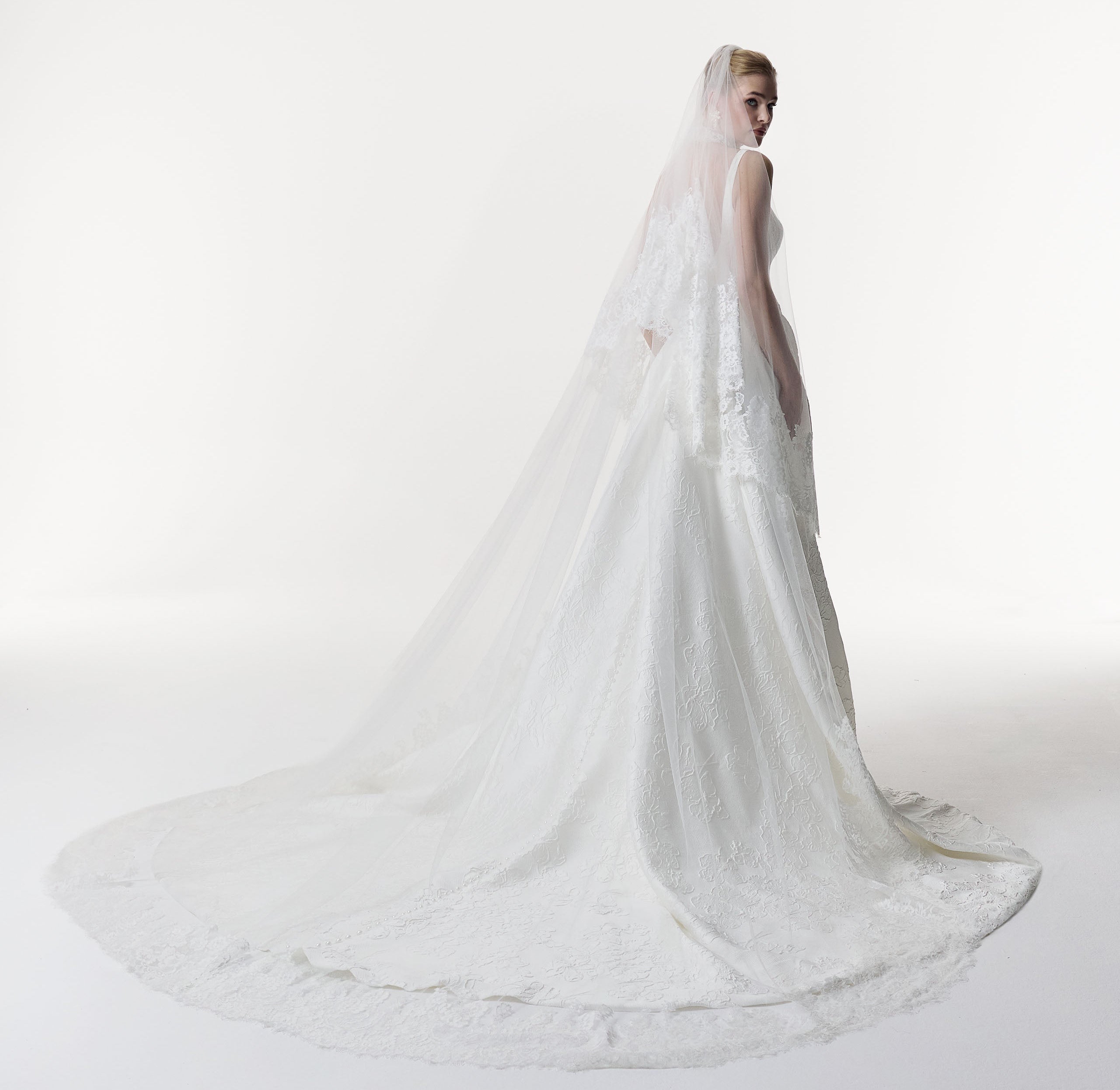 square neckline with basque waist A-Line skirt in silk embossed jacquard with lace choker and lace veil