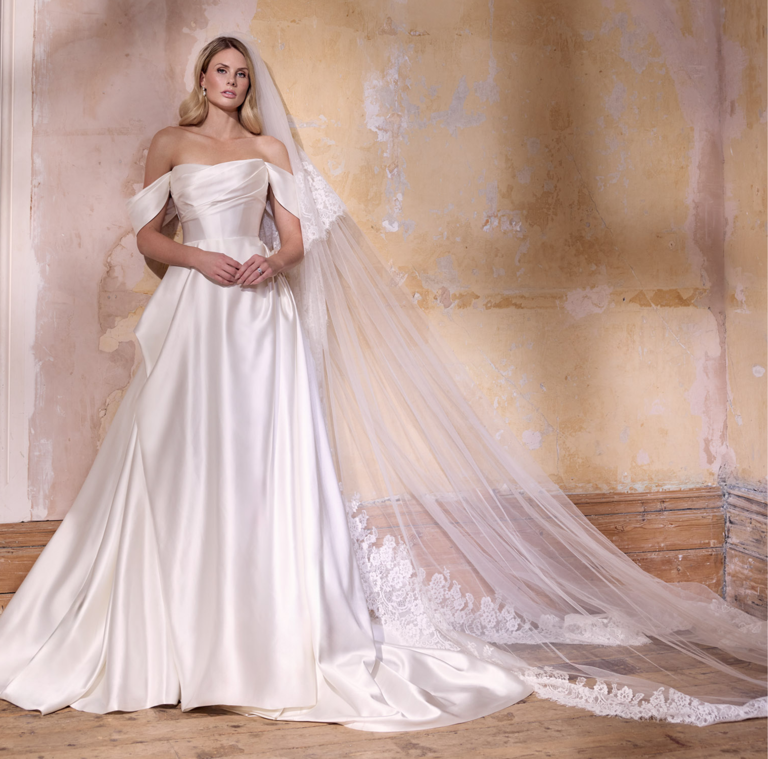 Italian duchess silk satin with soft draped straps and internal corset with lace-up back and dramatic with lace wedding veil