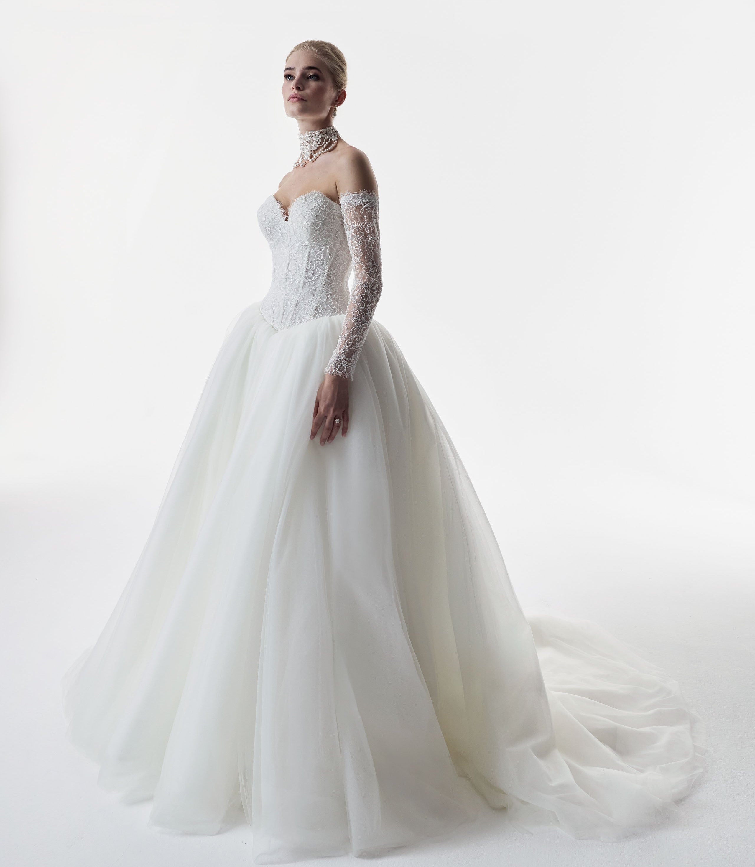 strapless sweetheart neckline corset basque waist bodice in corded French lace and full ballgown skirt in soft tulle
with matching sleeves and choker