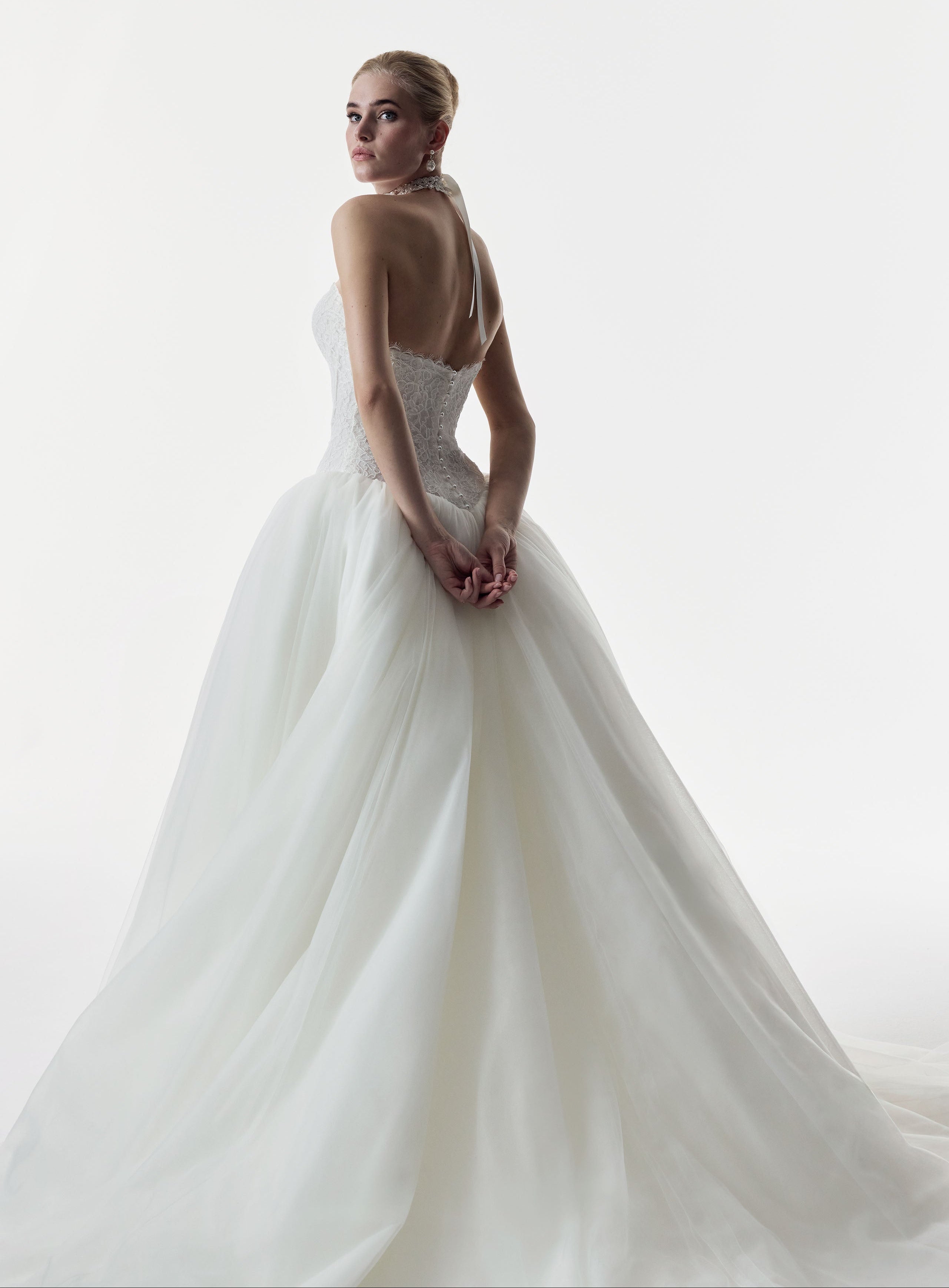 strapless sweetheart neckline corset basque waist bodice in corded French lace and full ballgown skirt in soft tulle
with pearl buttons and choker