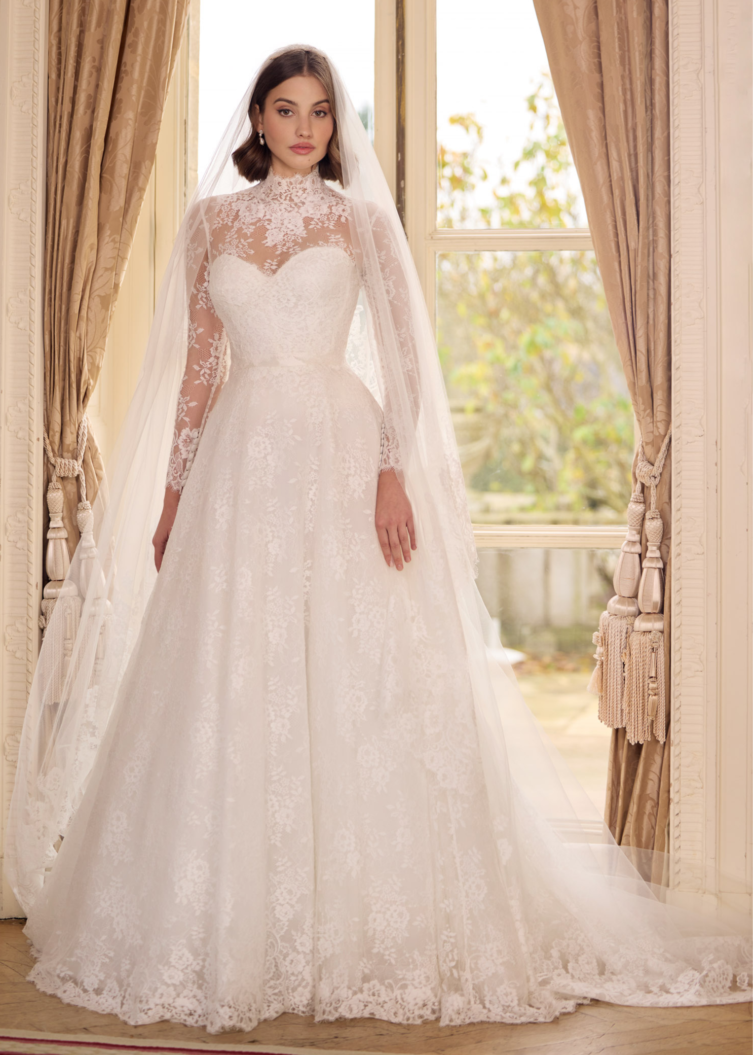 strapless French Chantilly A-line gown with intricate pearl button