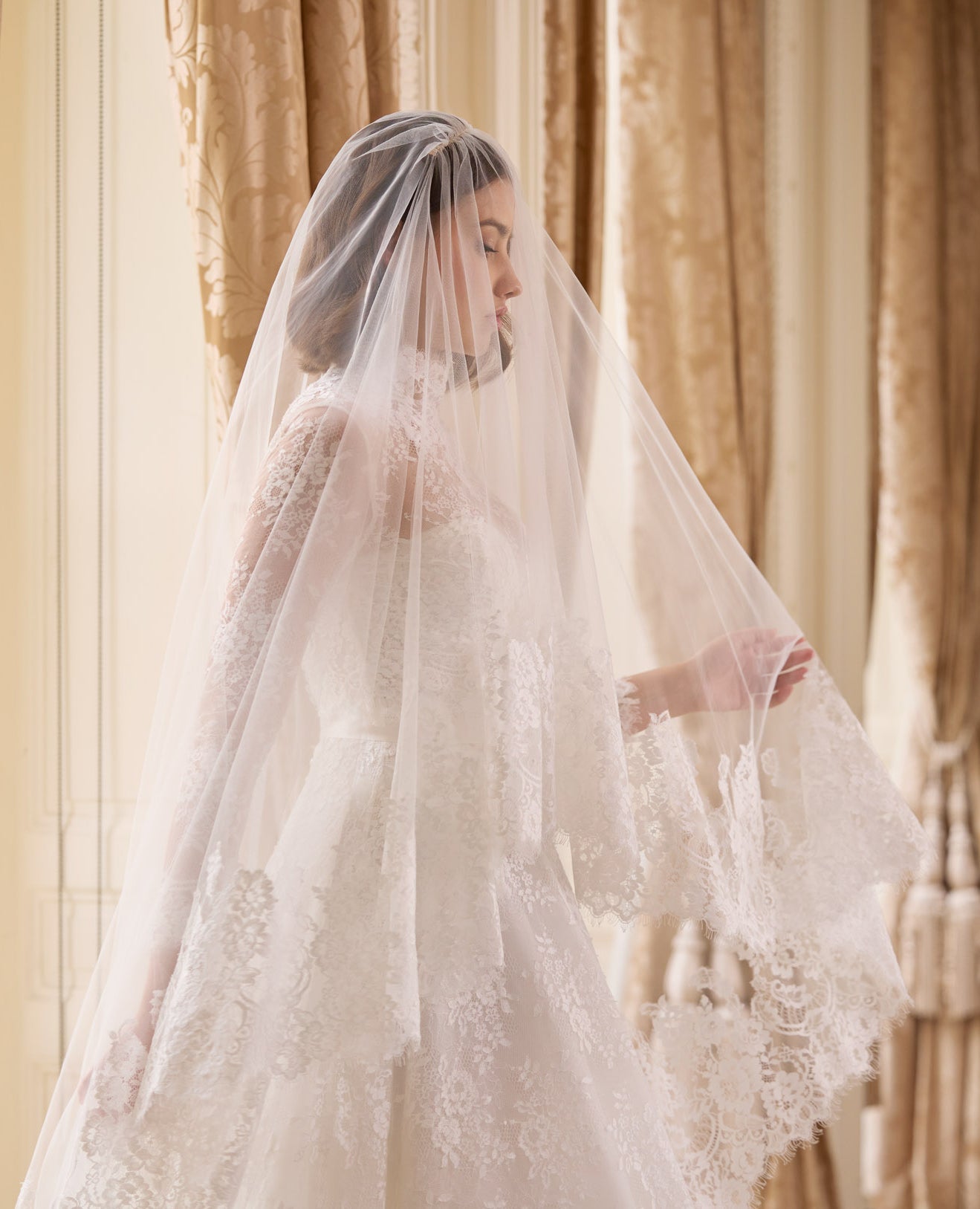 strapless French Chantilly A-line gown with intricate pearl button