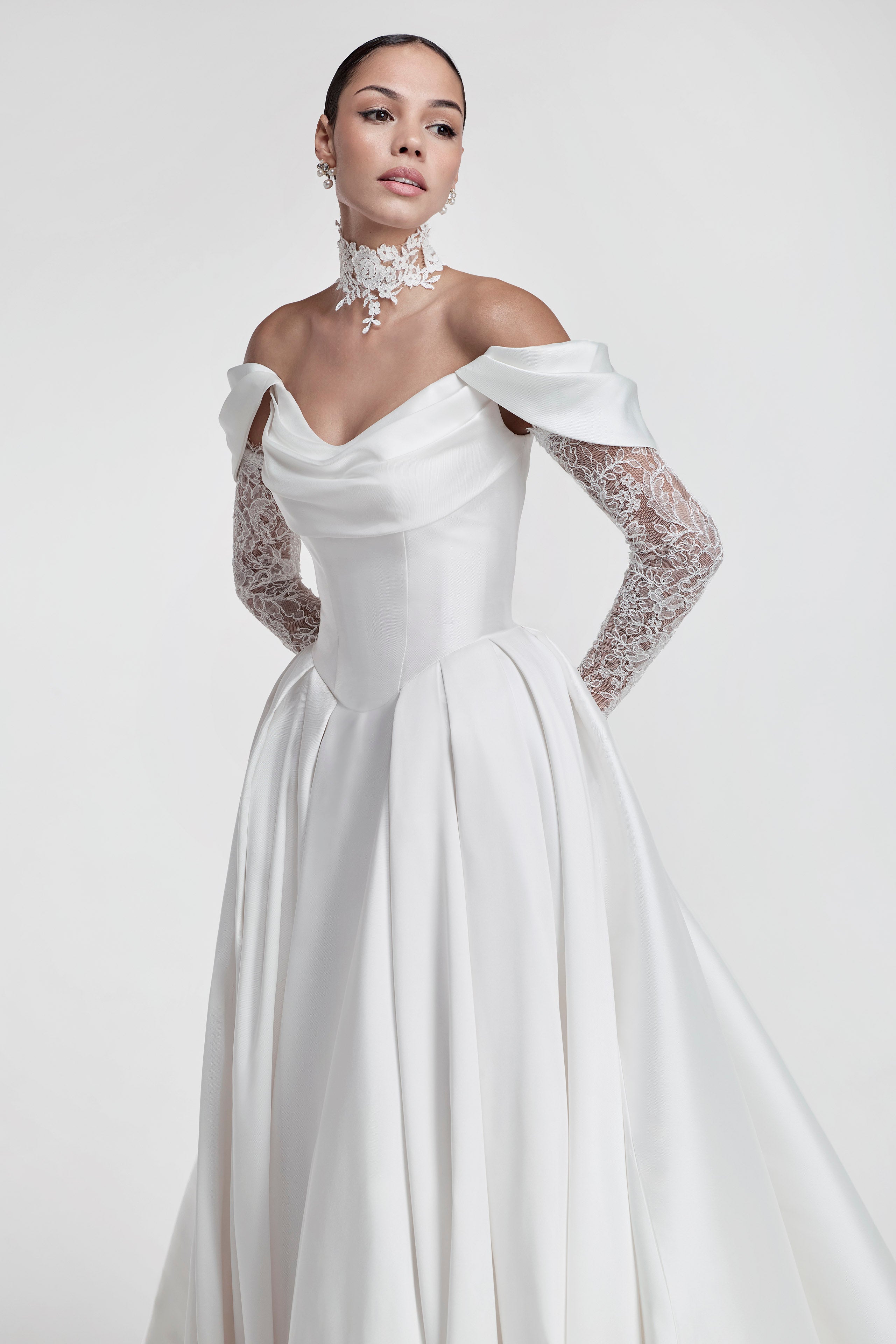 silk Mikado swoop neckline with a basque waist and pleated skirt