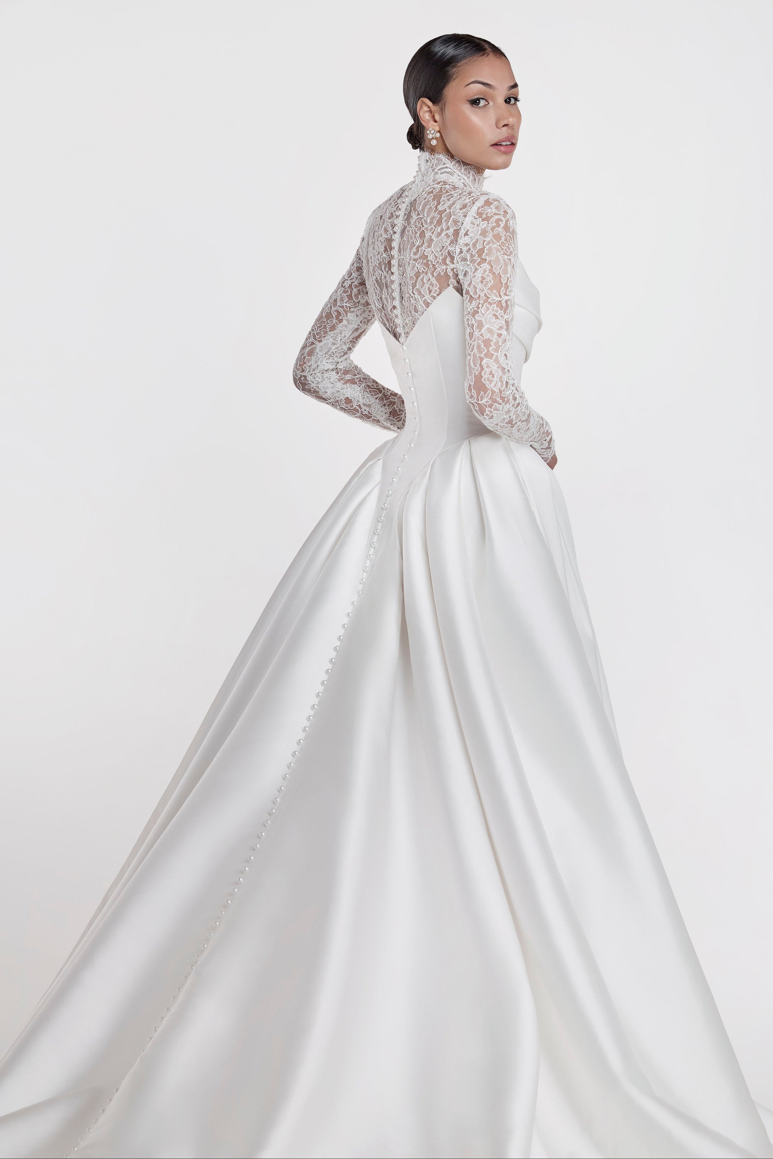silk Mikado swoop neckline with a basque waist and pleated skirt