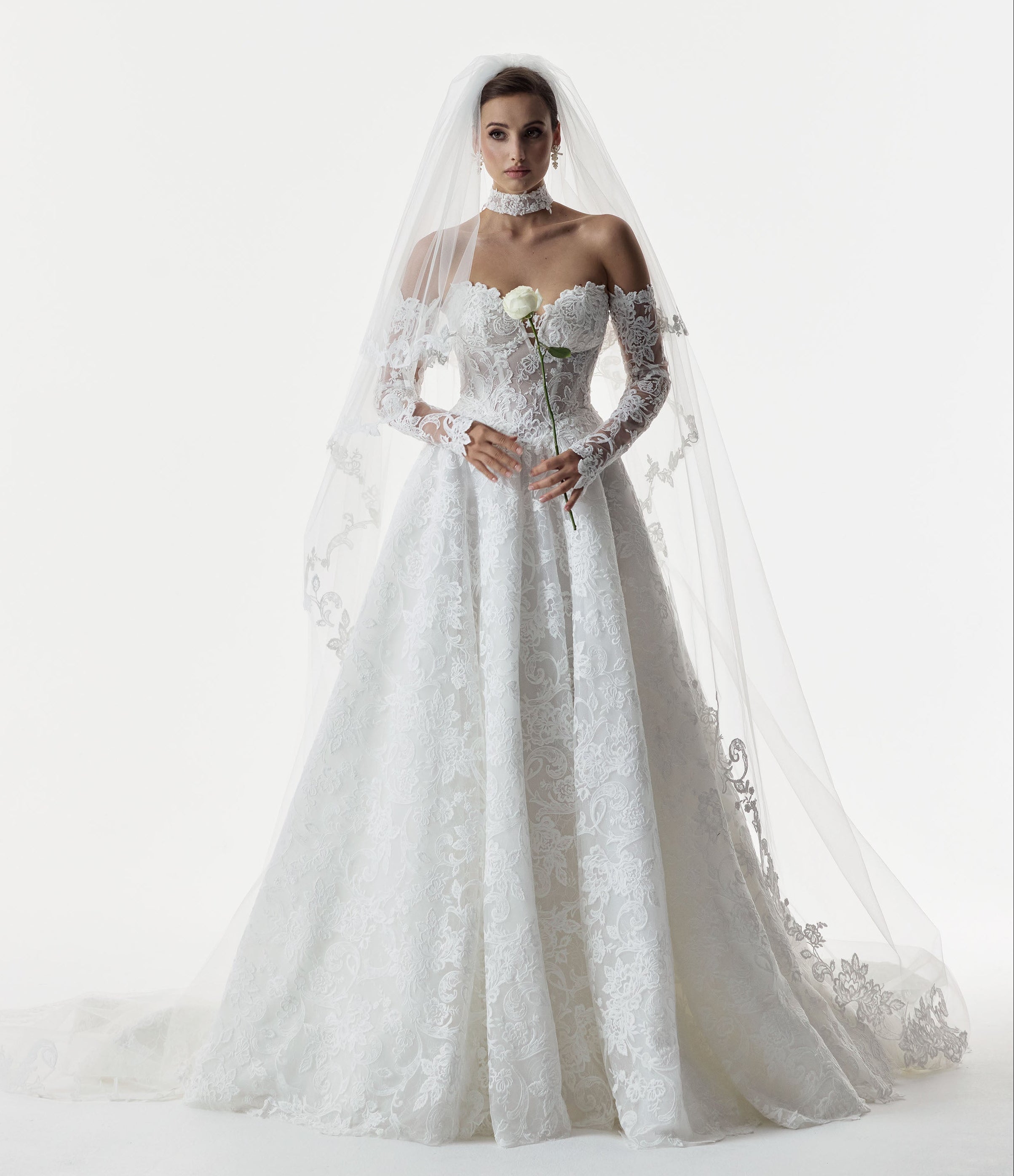 strapless sweetheart neckline corset A-line dress with embroidered lace layered over delicate Chantilly lace and lace choker and lace sleeves and double tier wedding veil