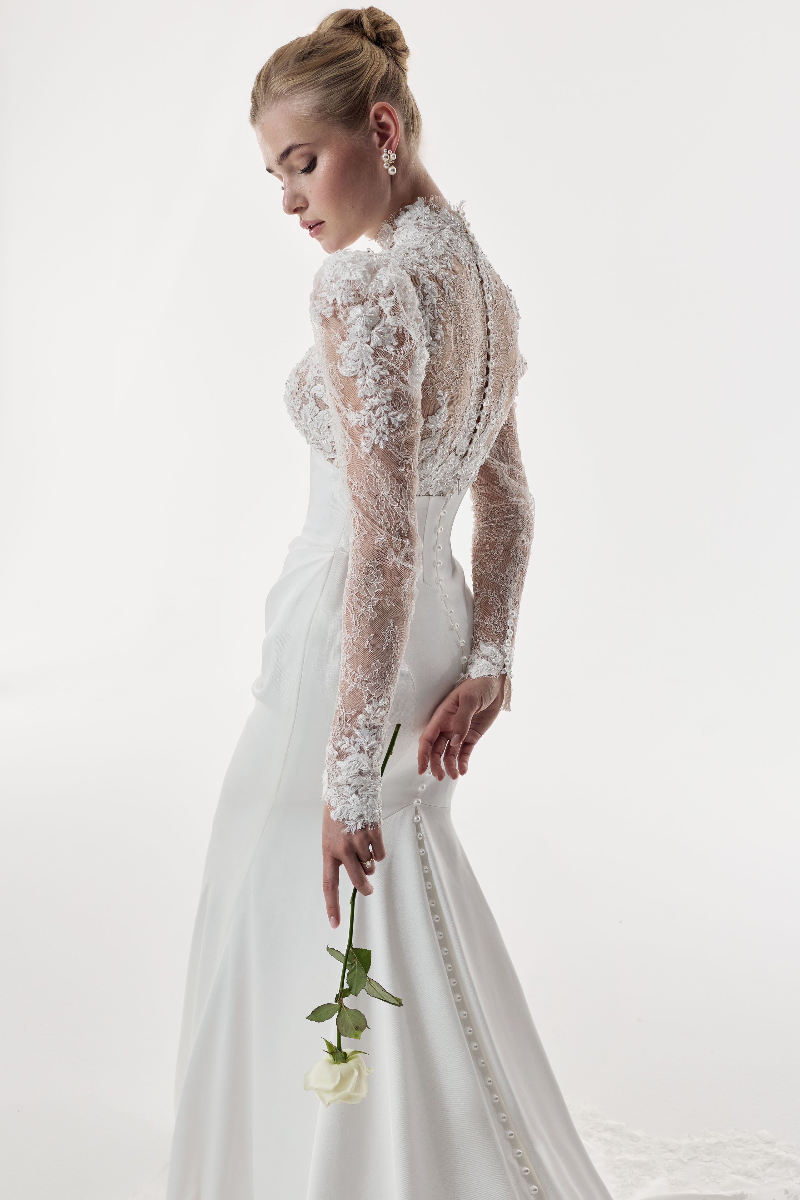 high neckline encrusted lace sleeves and bust, corset draped Japanese crepe skirt with illusion lace train dress with pearl buttons