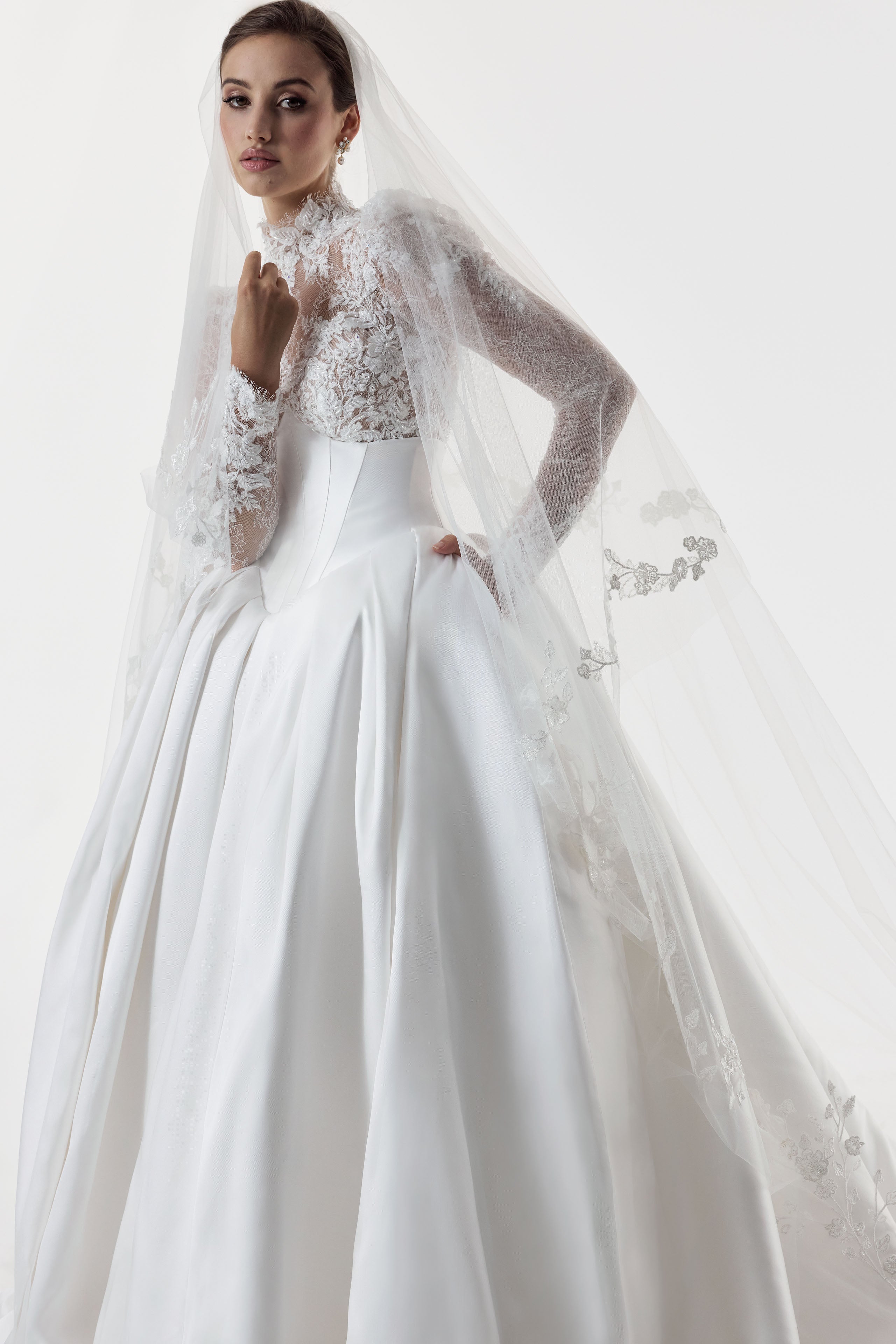 high neck encrusted lace lone sleeve bodice with corset and basque waist with full silk mikado A-line ballgown skirt and lace veil