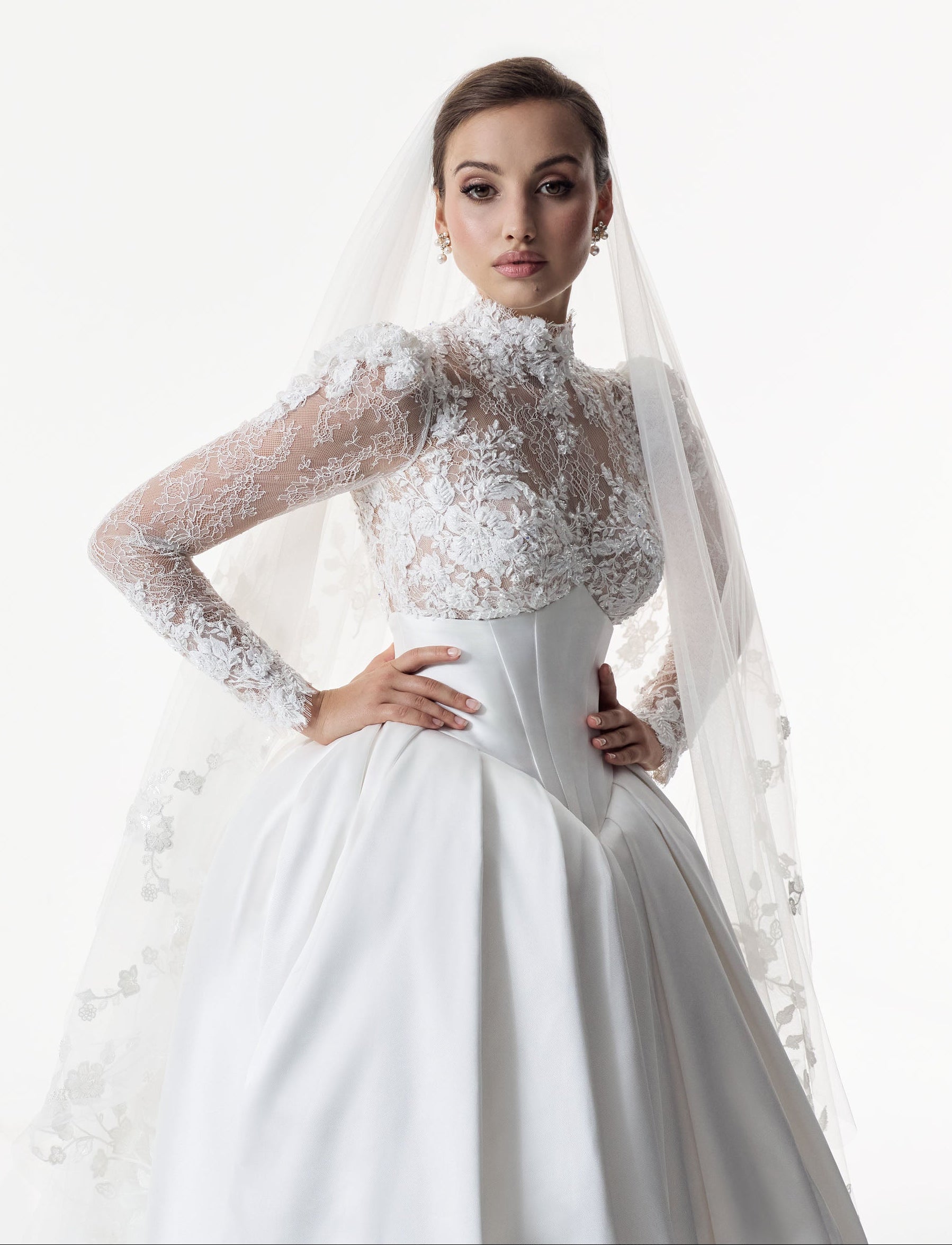 high neck encrusted lace long sleeve bodice with corset and basque waist with full silk mikado A-line ballgown skirt with veil