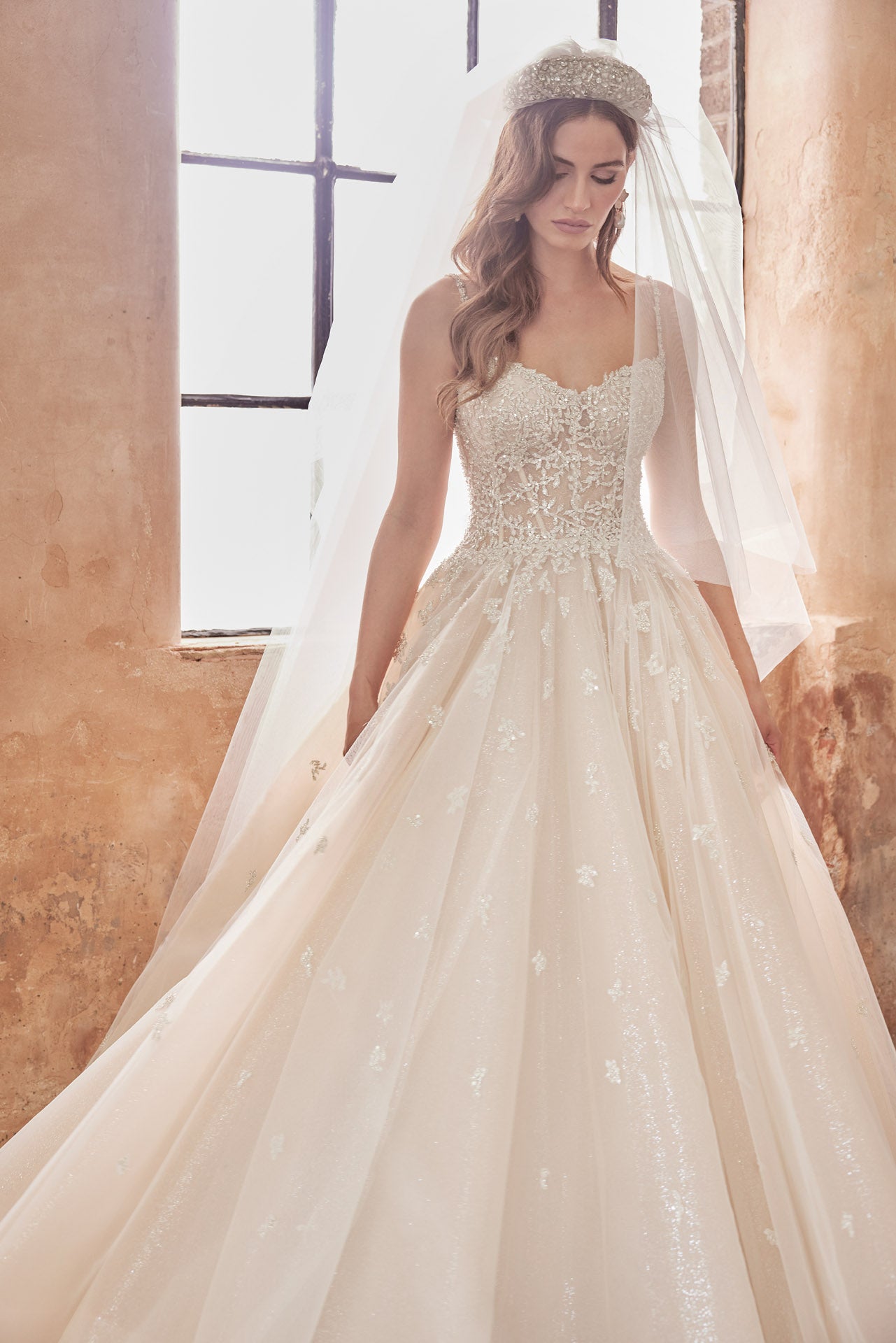 Embellished princess gown, metallic beaded lace bodice and beaded straps. Full skirt with crystal buttons on back.