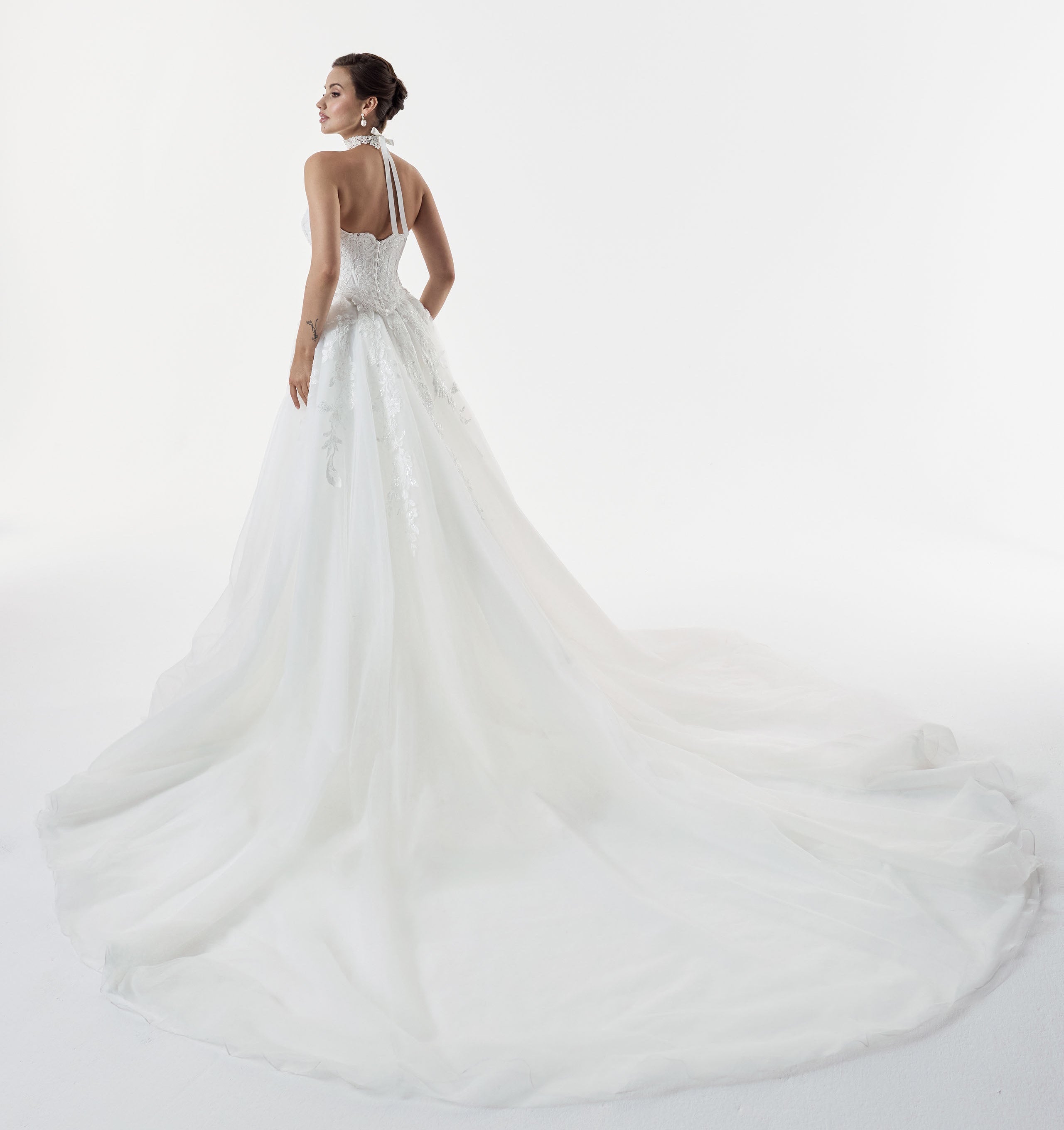 strapless scoop neckline embellished lace applique layered over Chantilly lace corset bodice basque waist with a detachable fitted skirt and choker and pearl buttons on the back