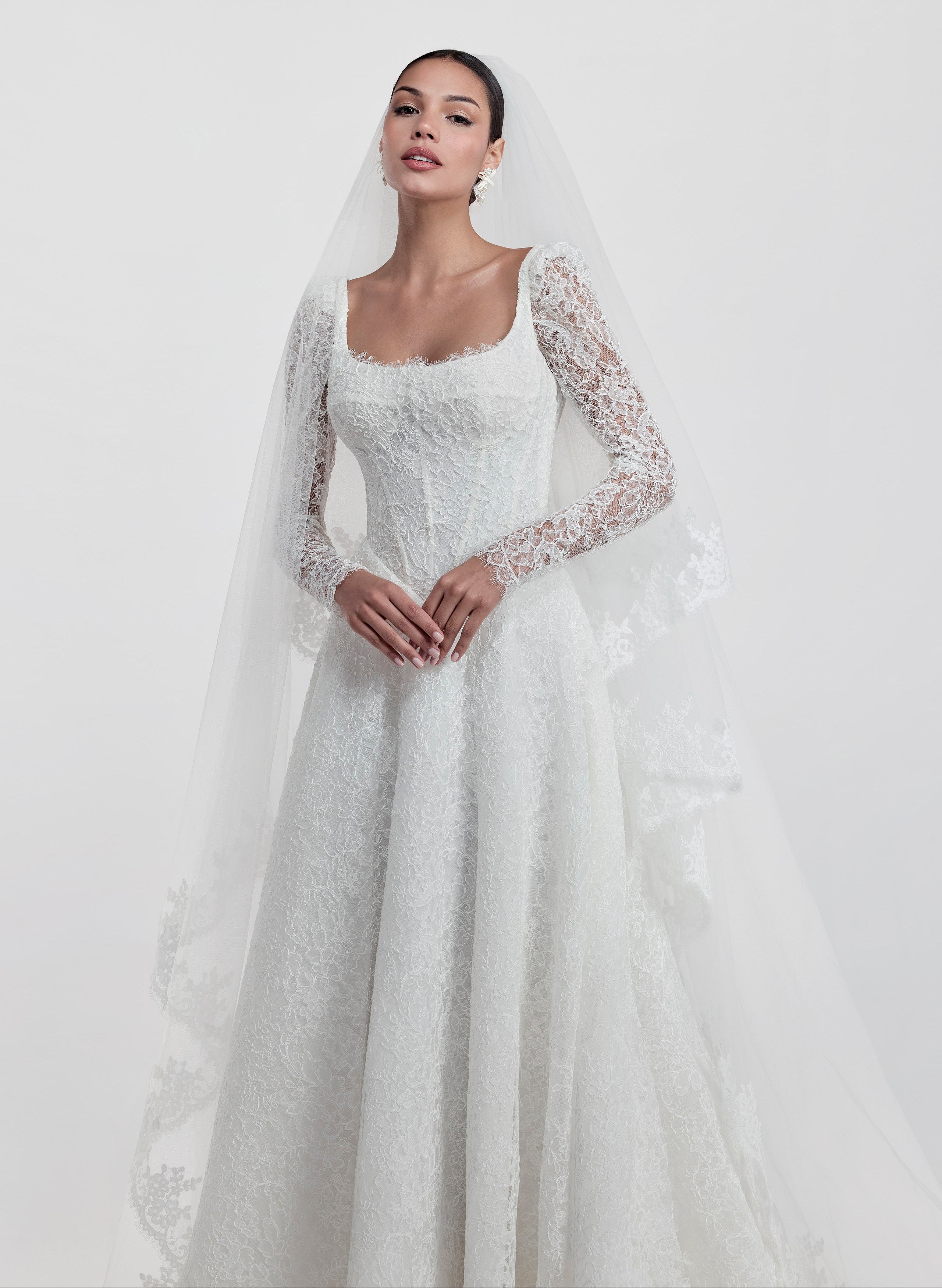 lace square neckline with basque waist and corset and A-line skirt with detachable lace sleeves and lace veil