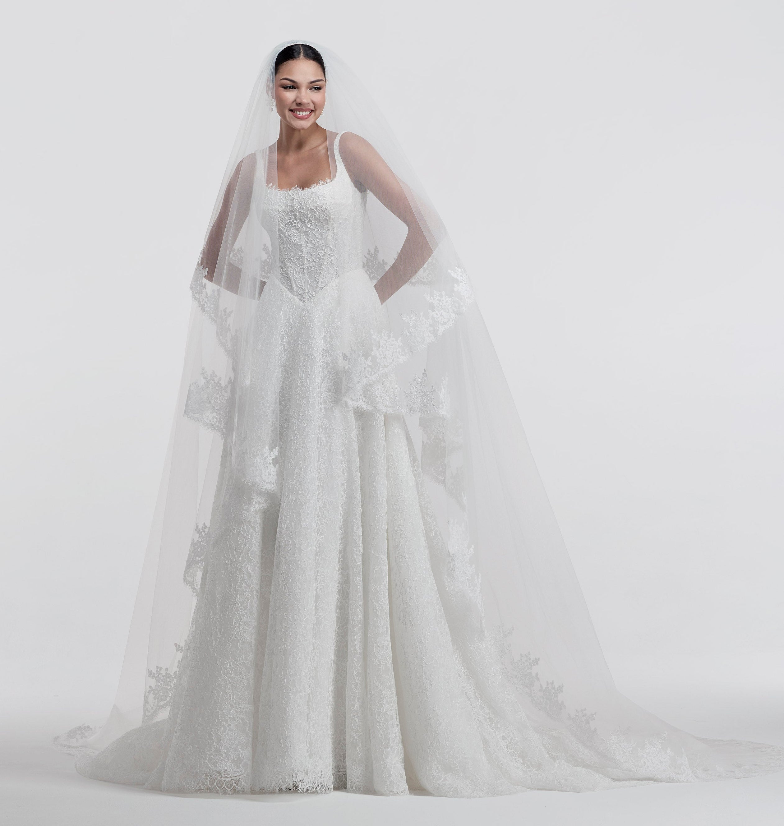 lace square neckline with basque waist and corset and A-line skirt and lace veil