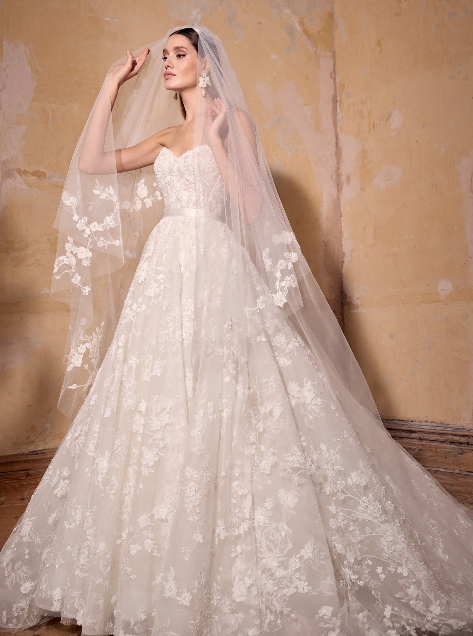 strapless A-line ballgown of 3d floral lace over rose-printed organza, lace up back with lux silk ribbon belt with lace wedding veil