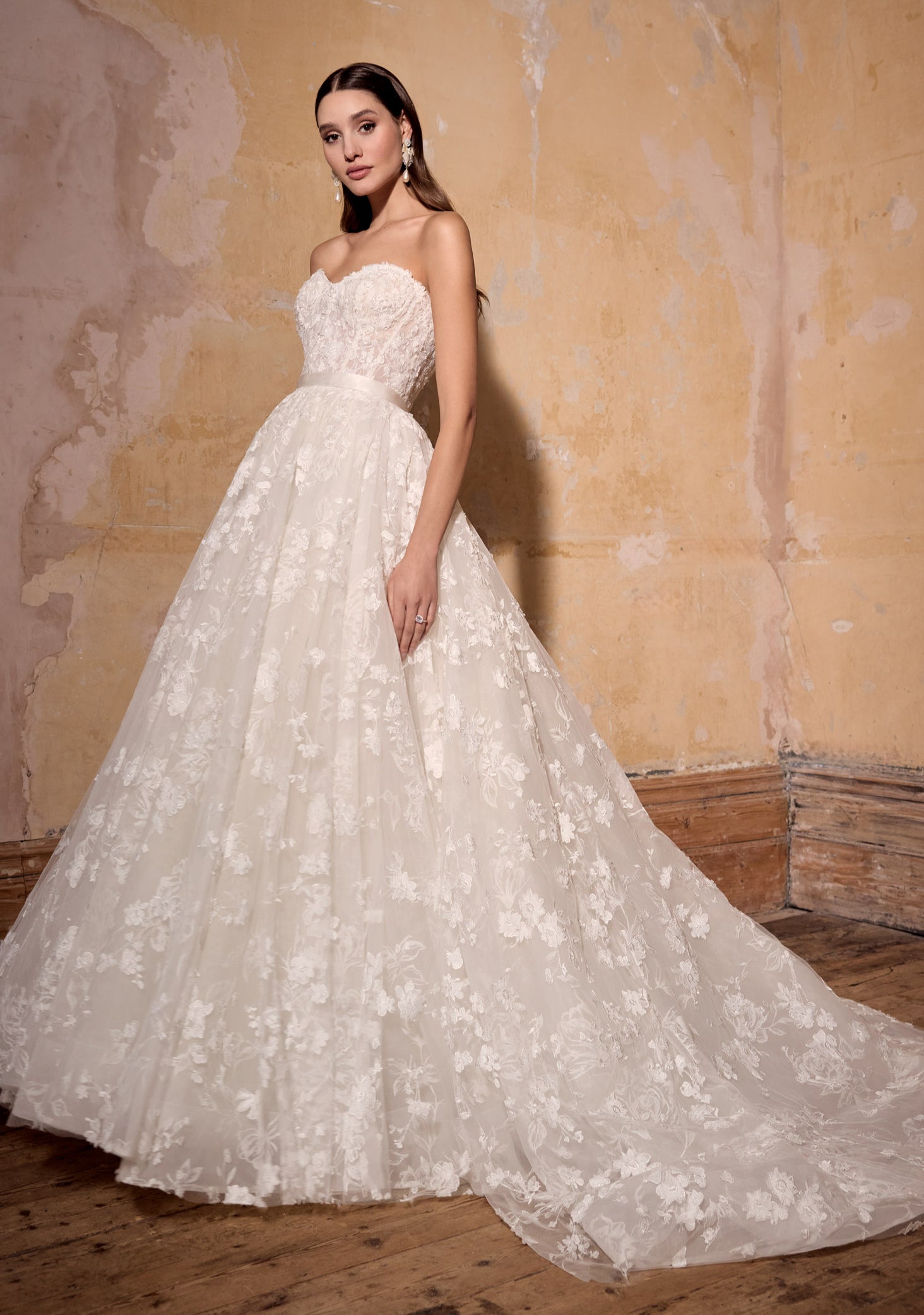 strapless A-line ballgown of 3d floral lace over rose-printed organza, lace up back with lux silk ribbon belt