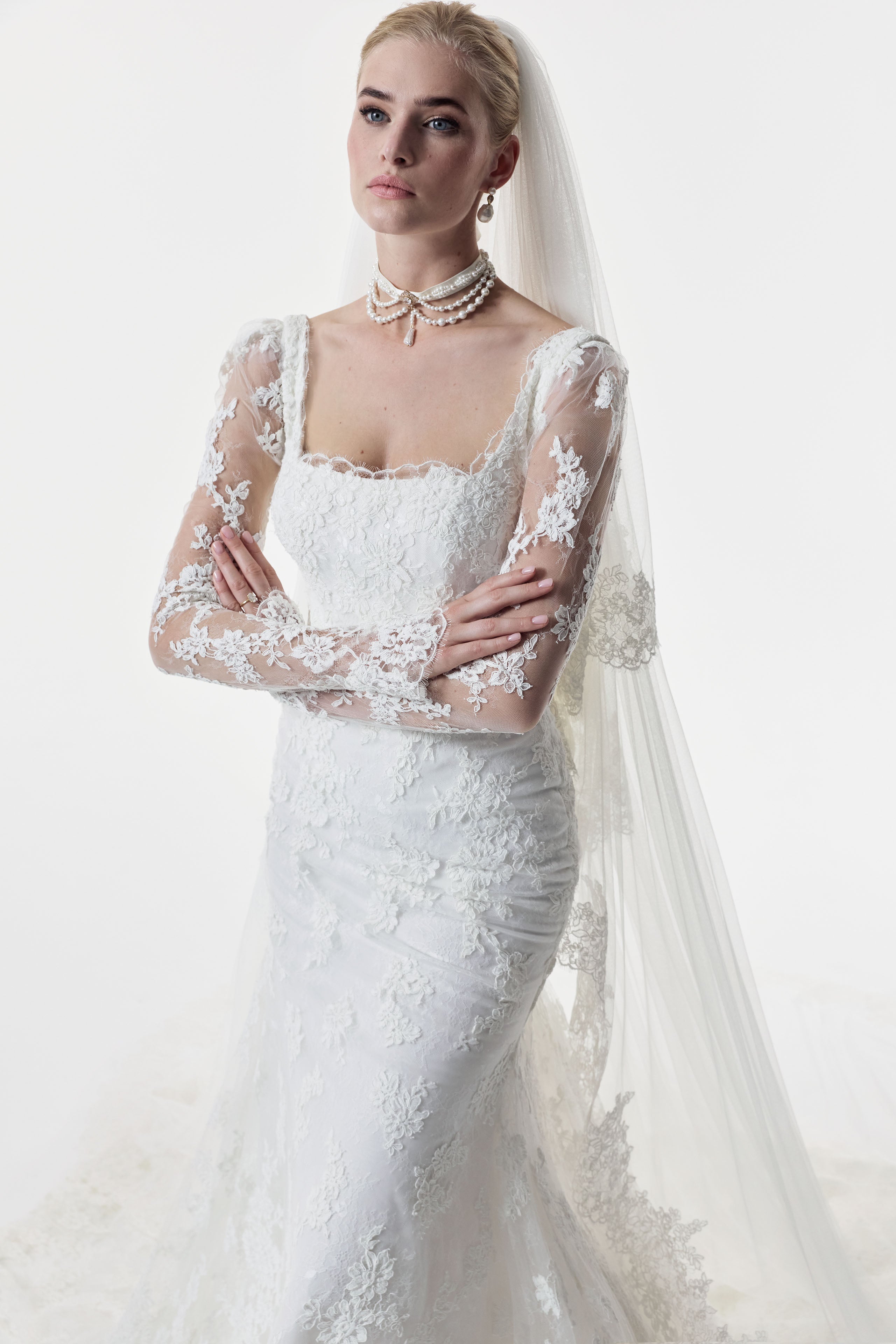 square neckline fitted sheath dress with corded lace layered over delicate Chantilly lace with matching sleeves and choker and wedding veil