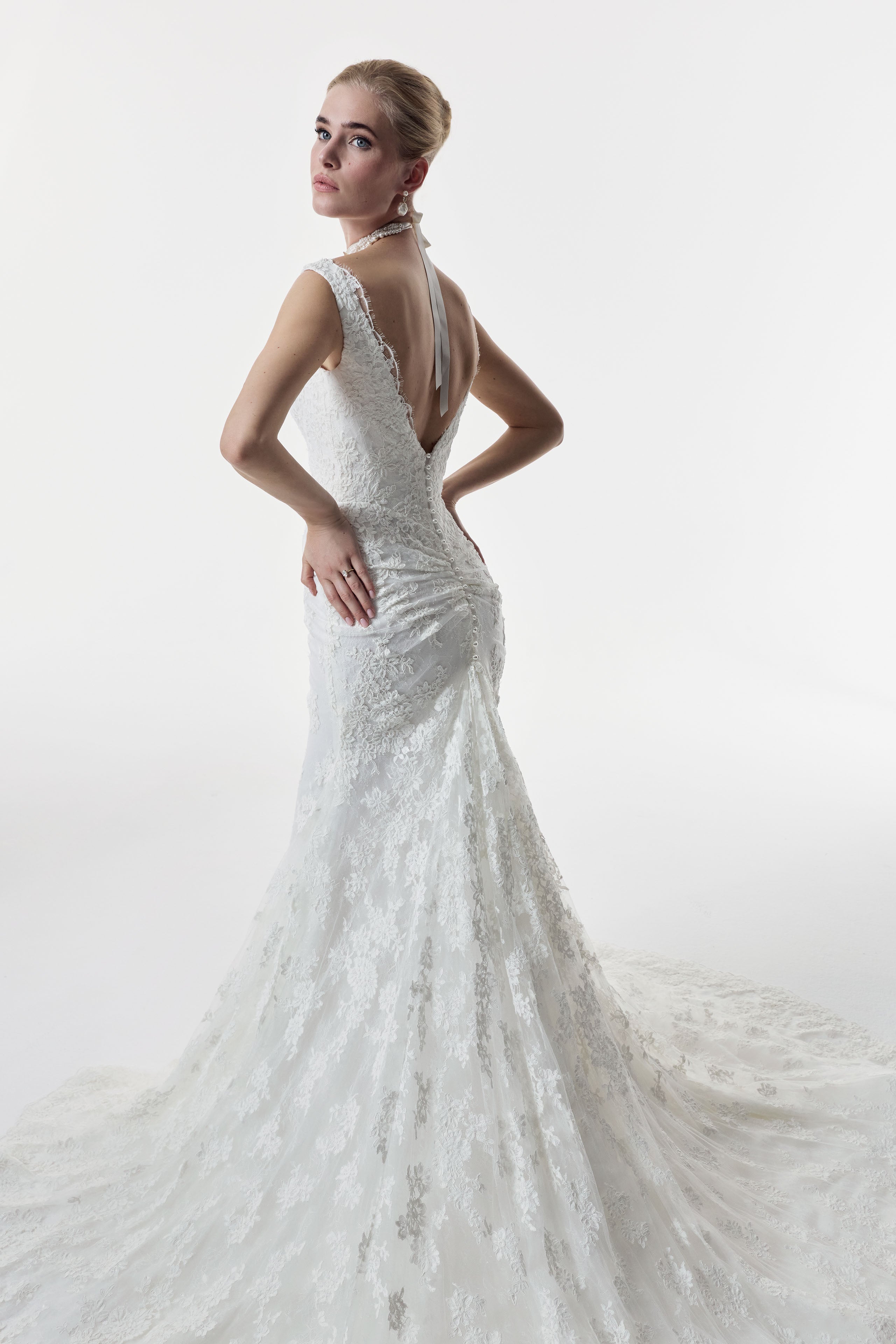 square neckline fitted sheath dress with corded lace layered over delicate Chantilly lace with low back and pearl buttons and choker