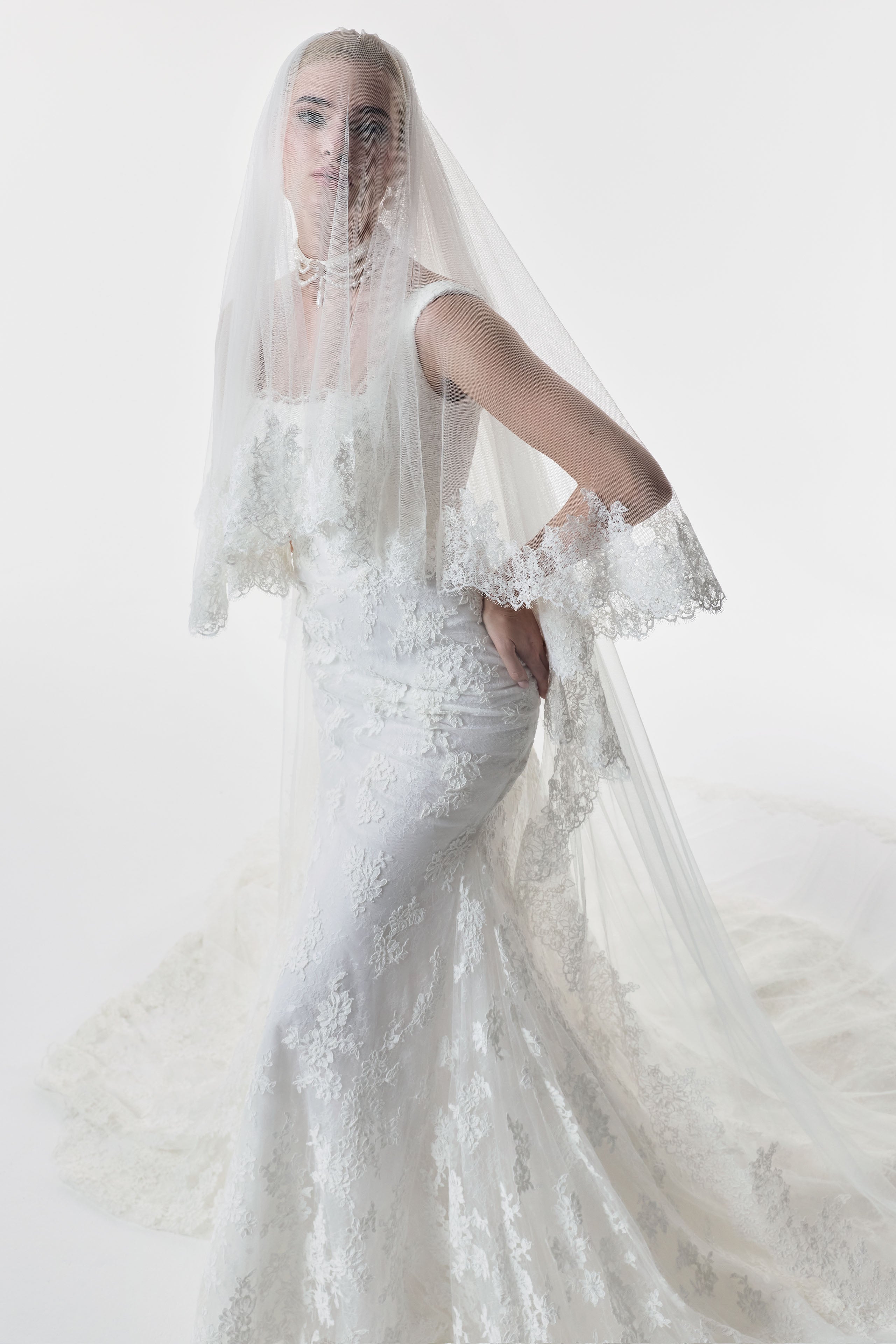 square neckline fitted sheath dress with corded lace layered over delicate Chantilly lace and choker and matching double tier wedding veil