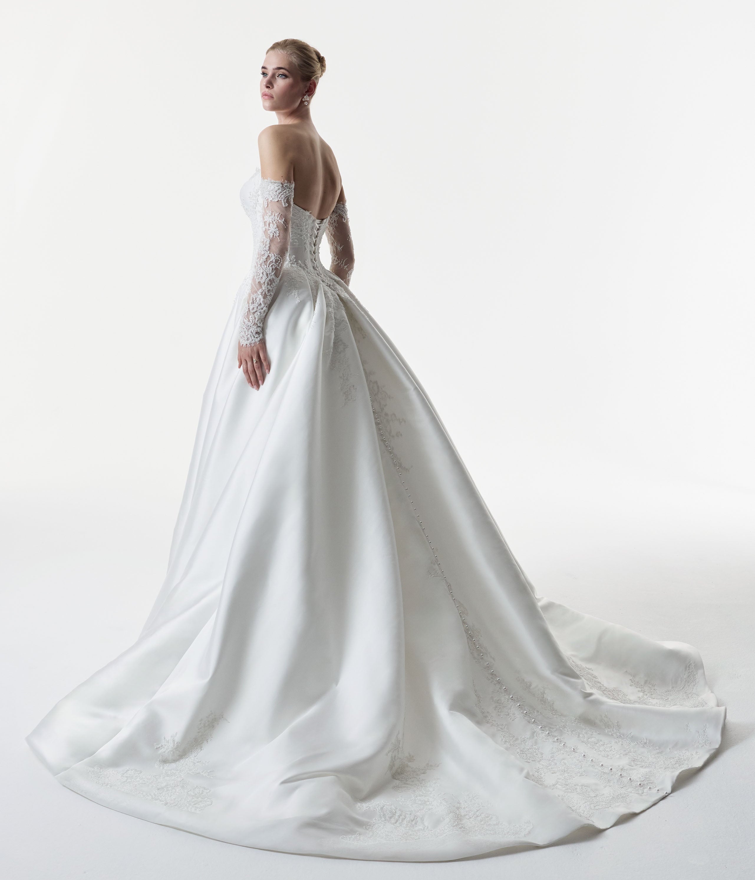 sweetheart neckline with silk Mikado and beaded lace with a basque waist corset and full A-line ballgown skirt with detachable matching lace sleeves