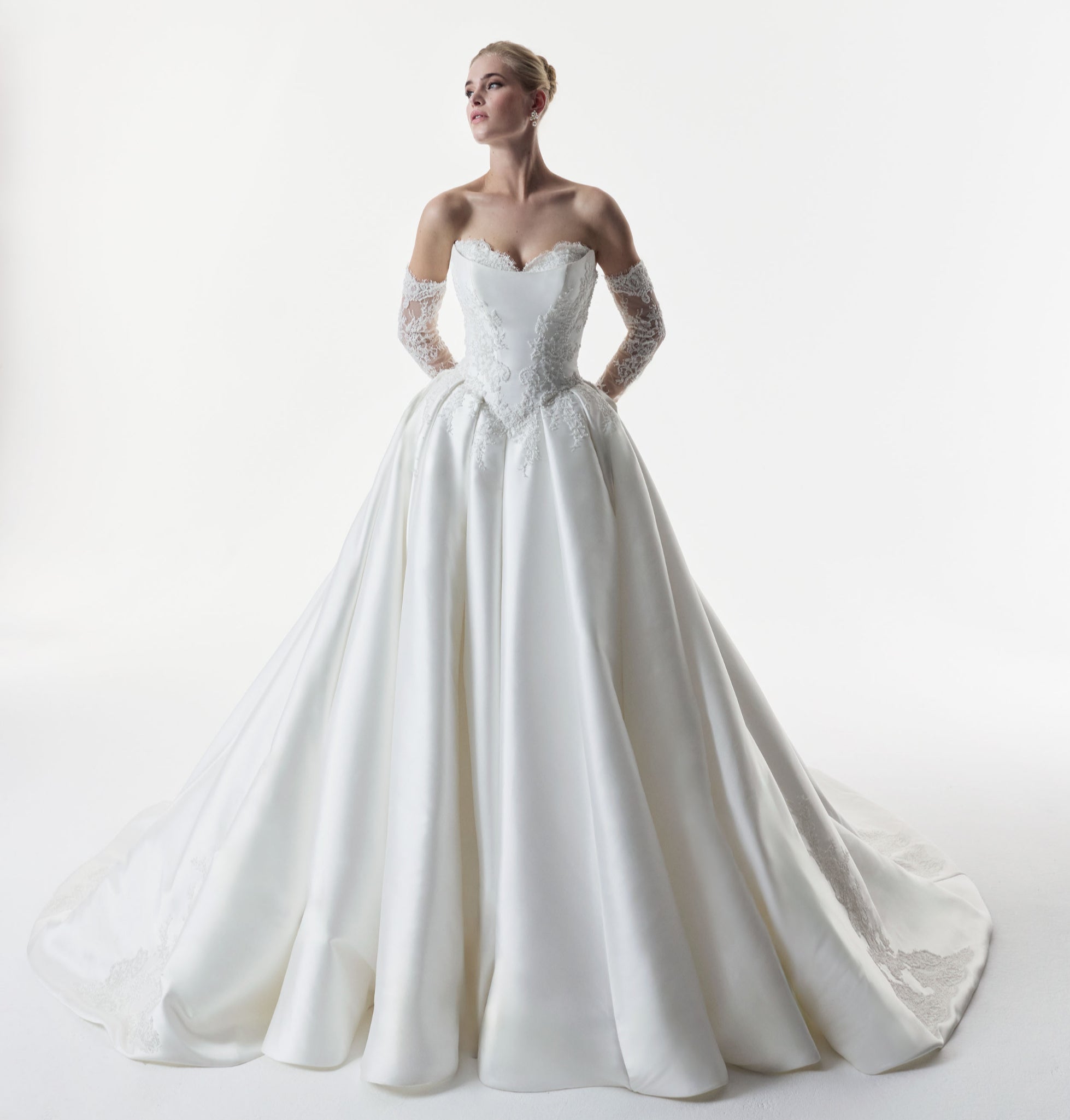 sweetheart neckline with silk Mikado and beaded lace with a basque waist corset and full A-line ballgown skirt with matching detachable sleeves