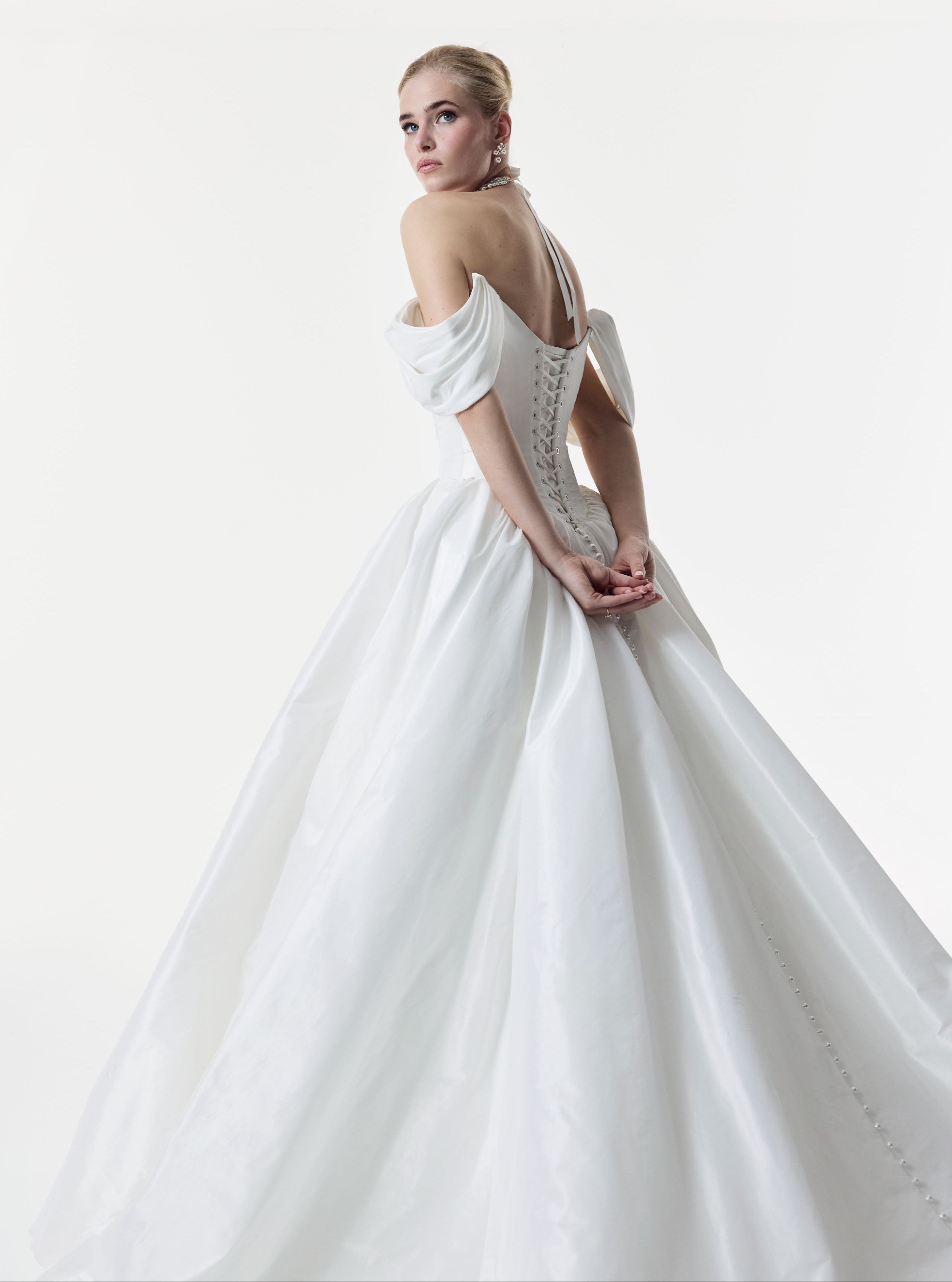 off the shoulder straps and a tightly ruched metallic taffeta bodice with lace up corset back and and basque waist full ballgown A-Line skirt and choker