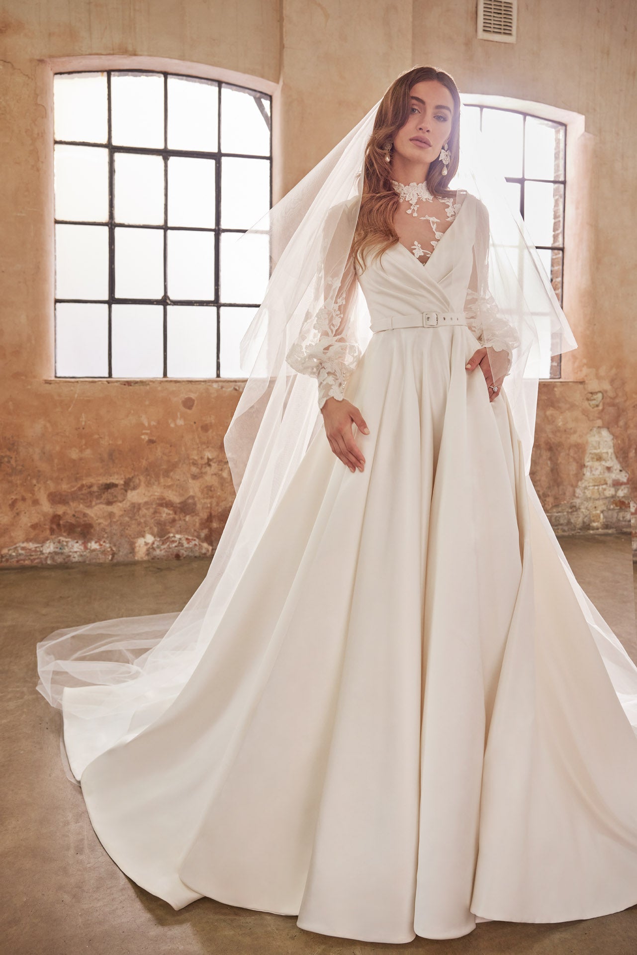 Full skirted a-line gown with flattering neckline, detachable belt and bow. Sumptuous satin with inner corset, full circle skirt with concealed pockets.